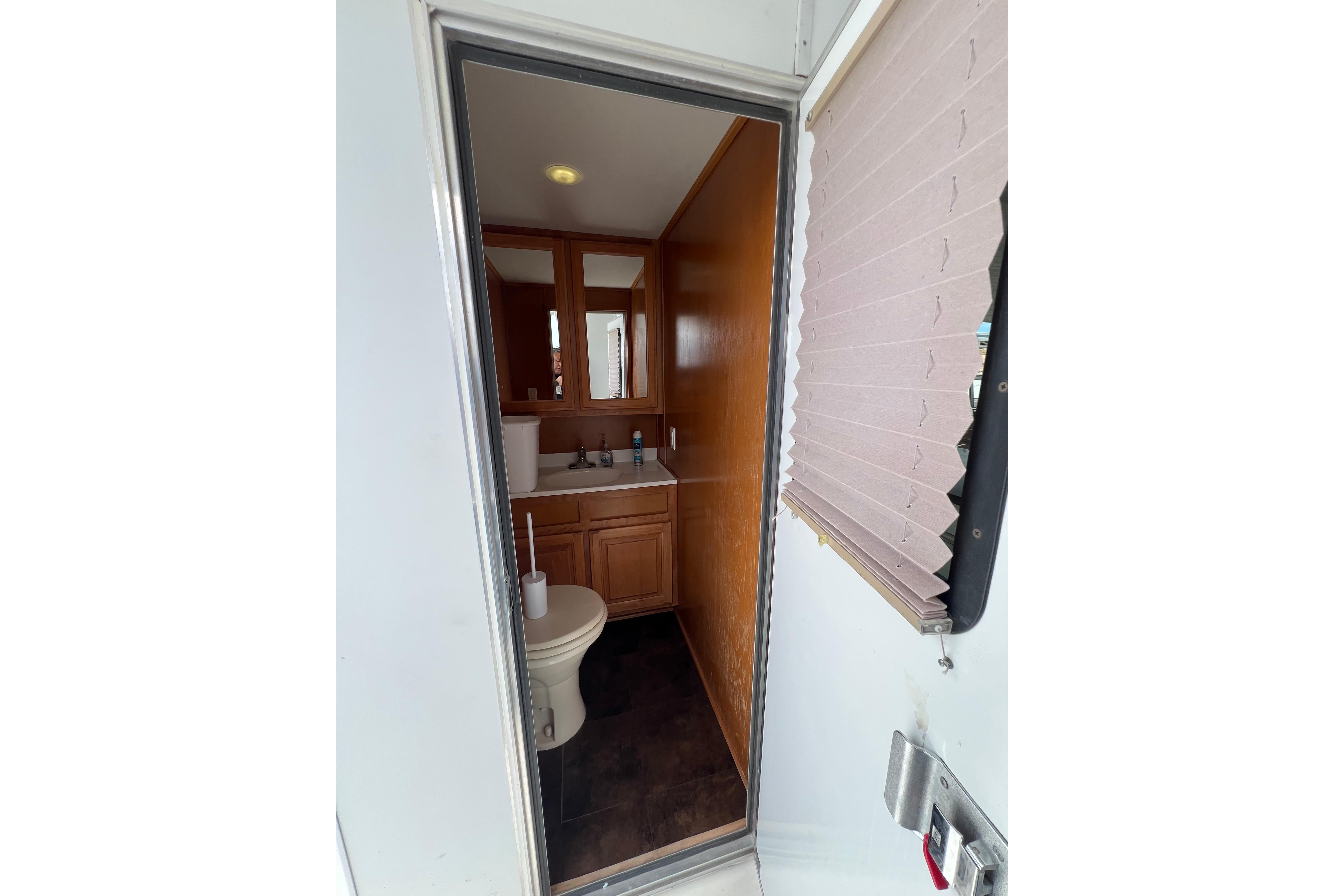 Bathroom interior of 2013 Destination Yacht Lotta Yachta, featuring wooden cabinetry and modern fixtures.