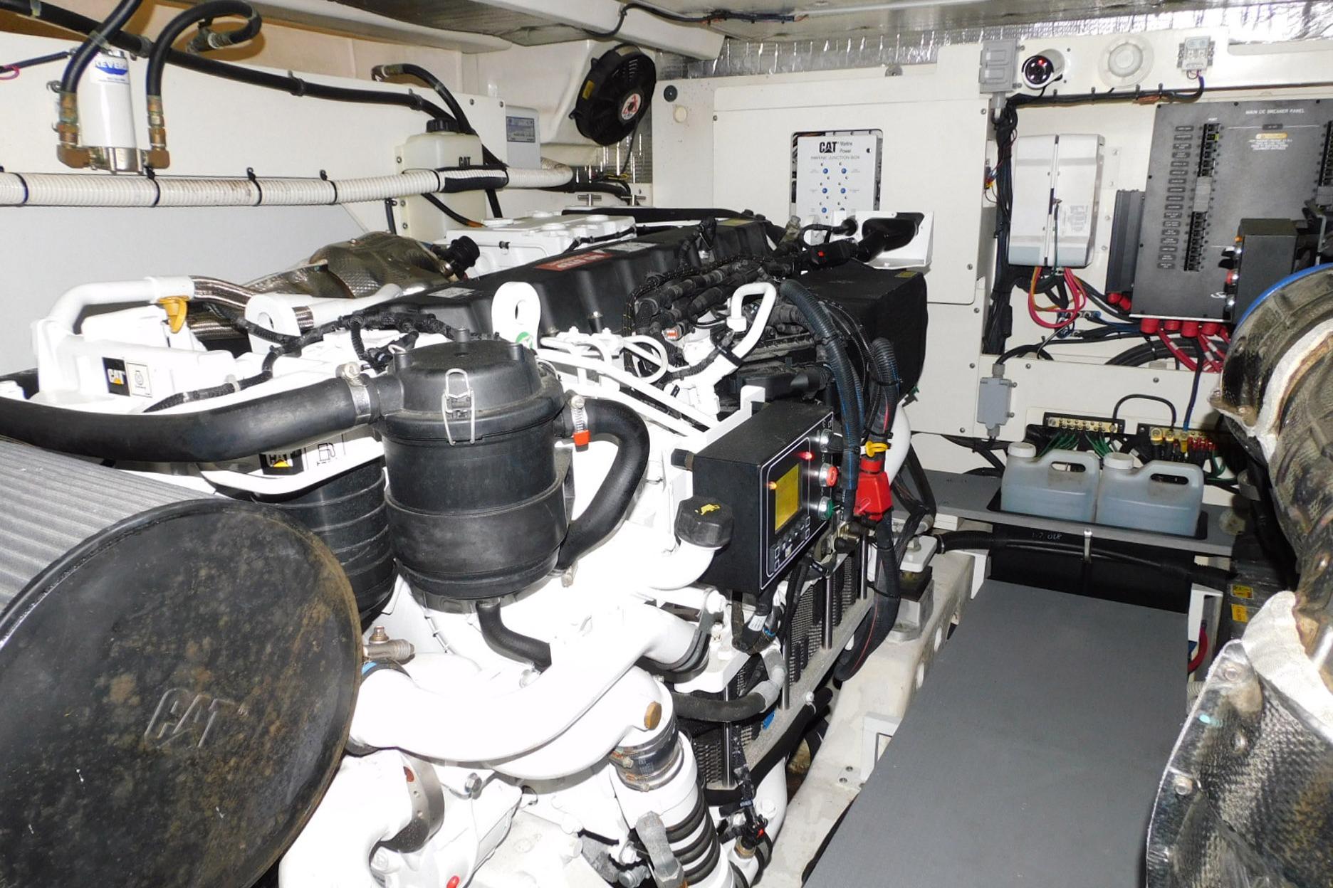 Engine room of a 2019 Sea Ray L550 yacht, featuring CAT machinery and electrical systems.