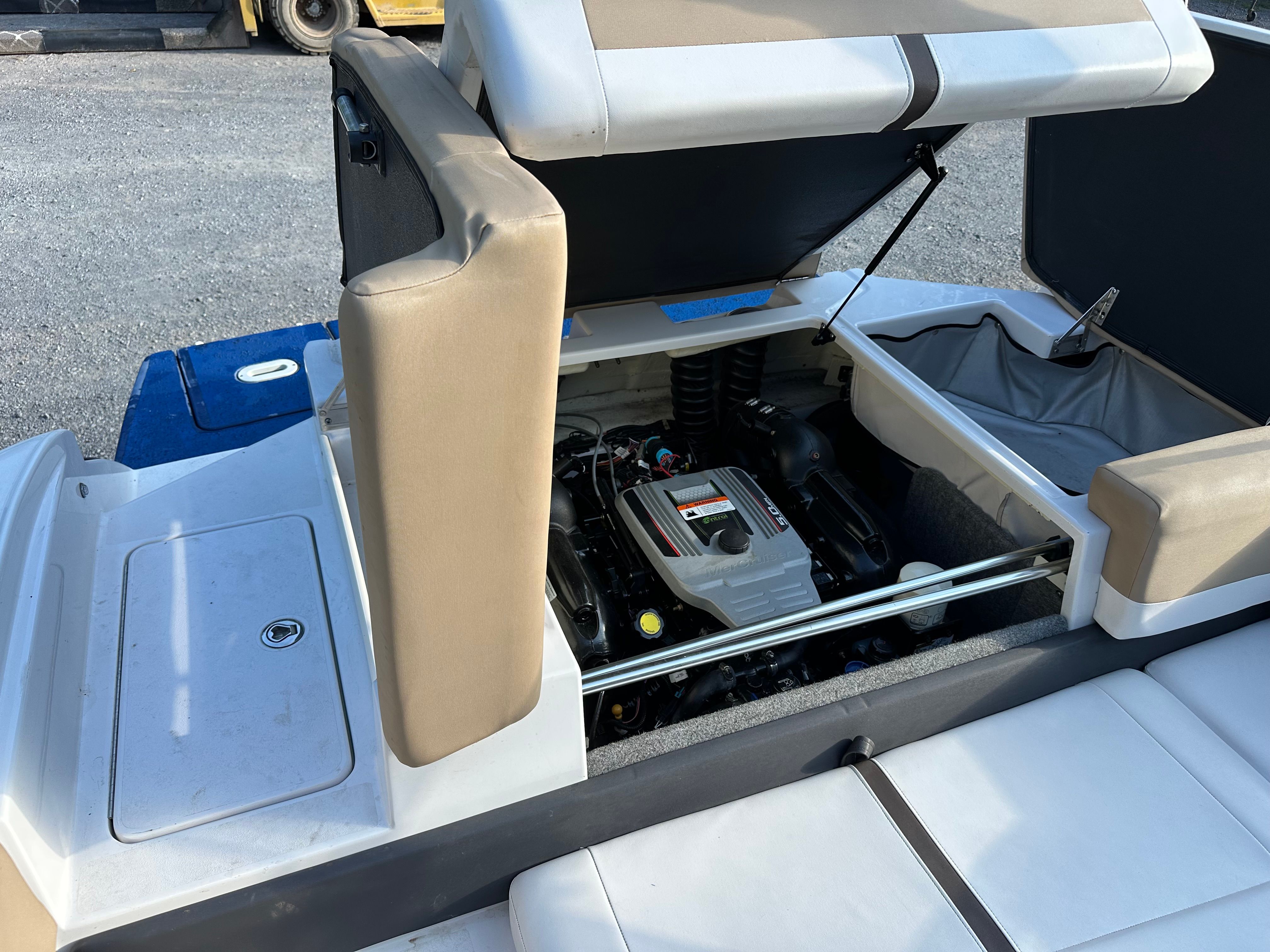 2012 Four Winns H210 boat engine and storage area.