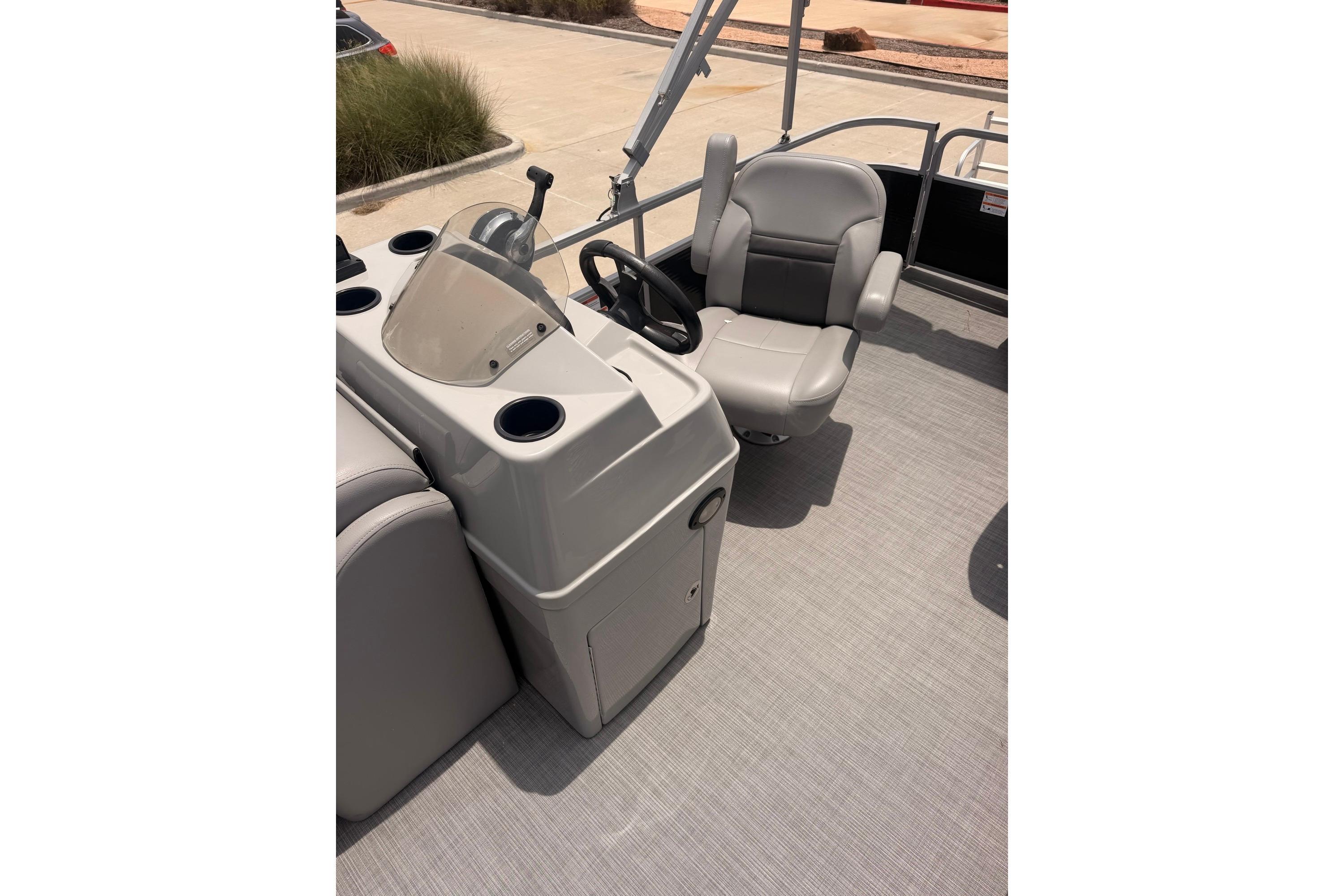 2021 Lowe SS 210 boat interior with steering console and captain's chair.