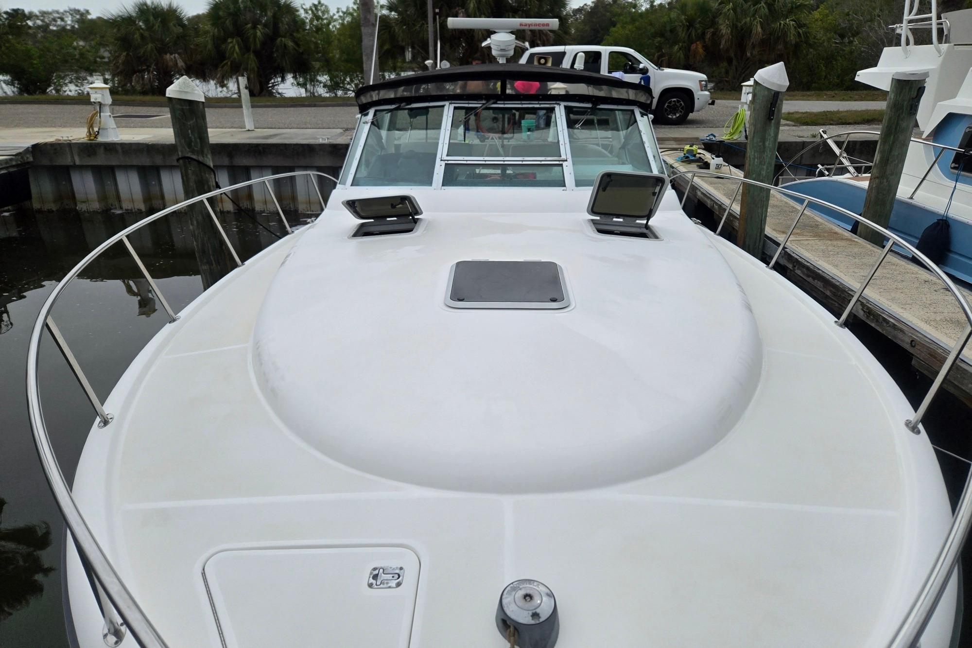 2002 Tiara Yachts 3500 Open docked, showcasing sleek design and spacious deck.