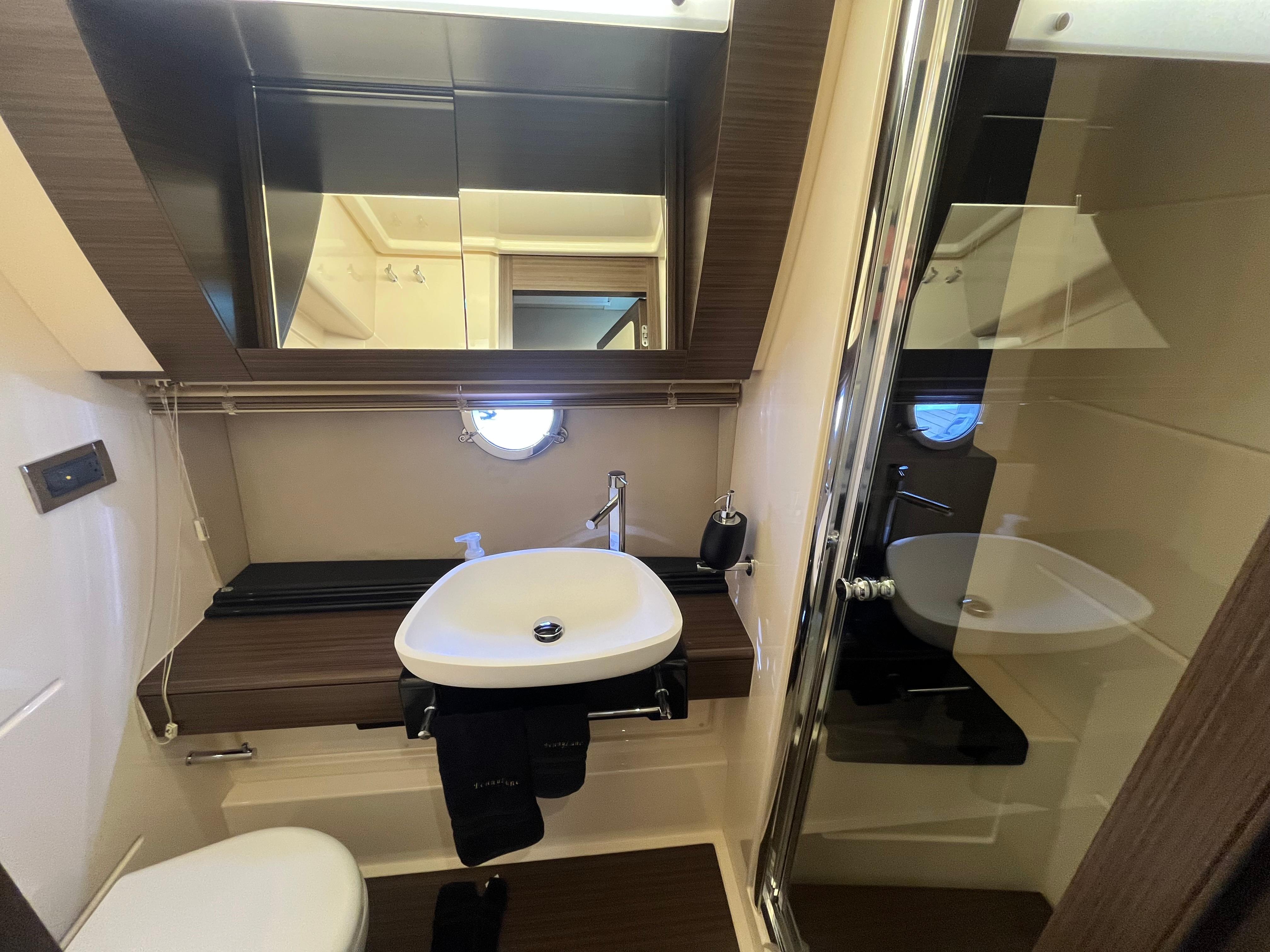 Luxurious bathroom interior of 2014 Azimut 55S yacht with modern fixtures and elegant design.