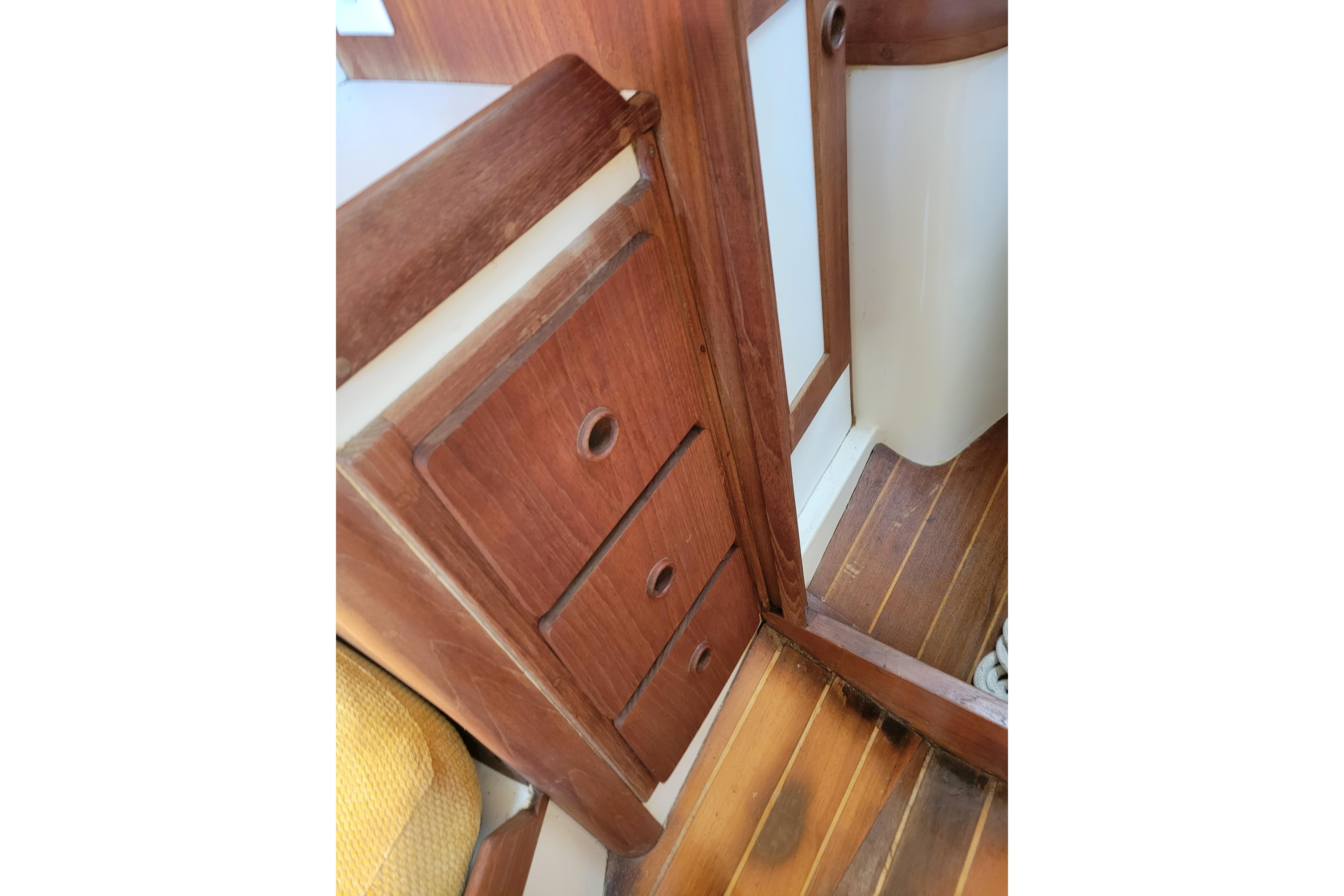Interior view of 1981 Sea Sprite 34 sailboat with wooden cabinetry and flooring.
