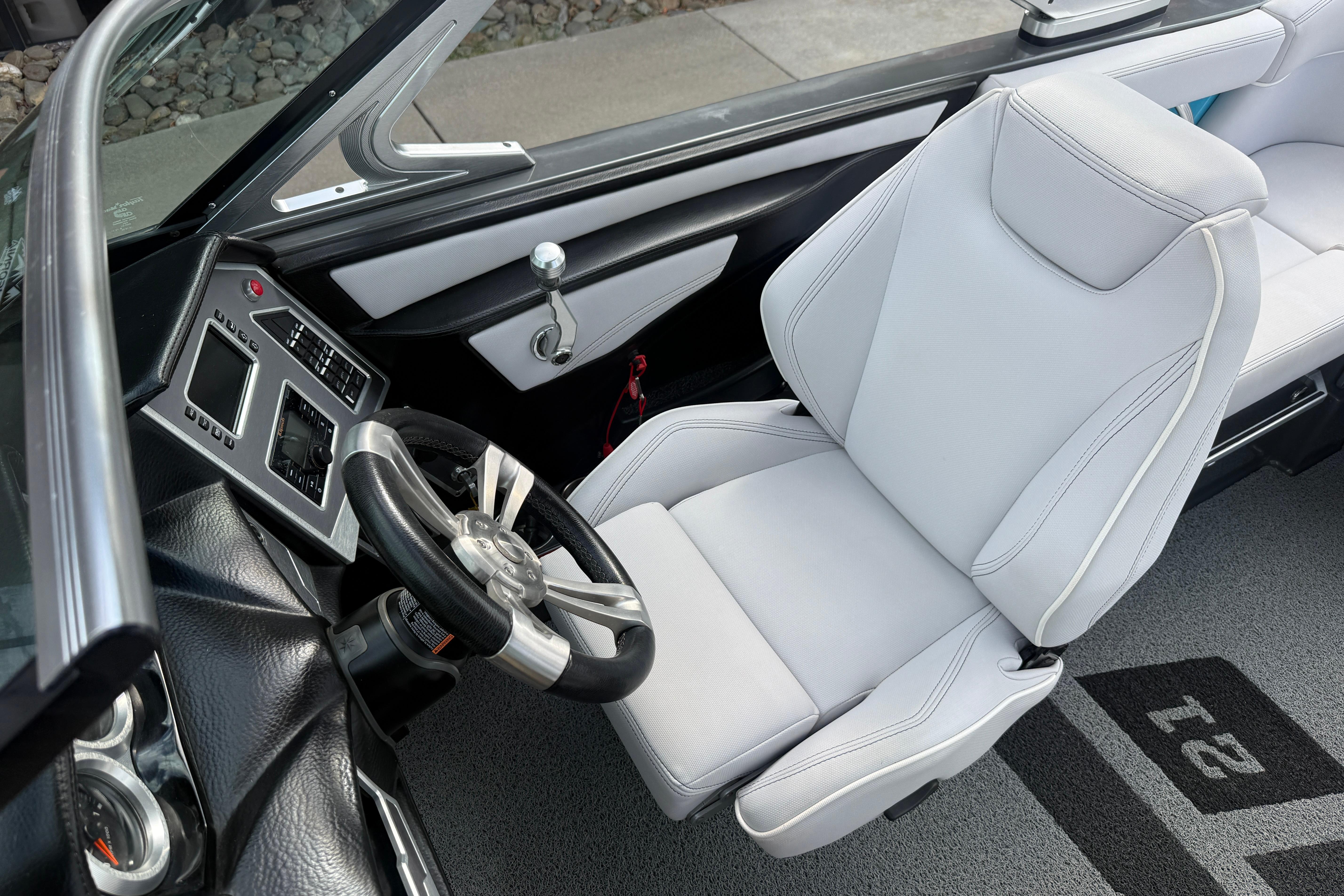 2018 MasterCraft XT21 boat interior with sleek steering wheel and modern dashboard controls.