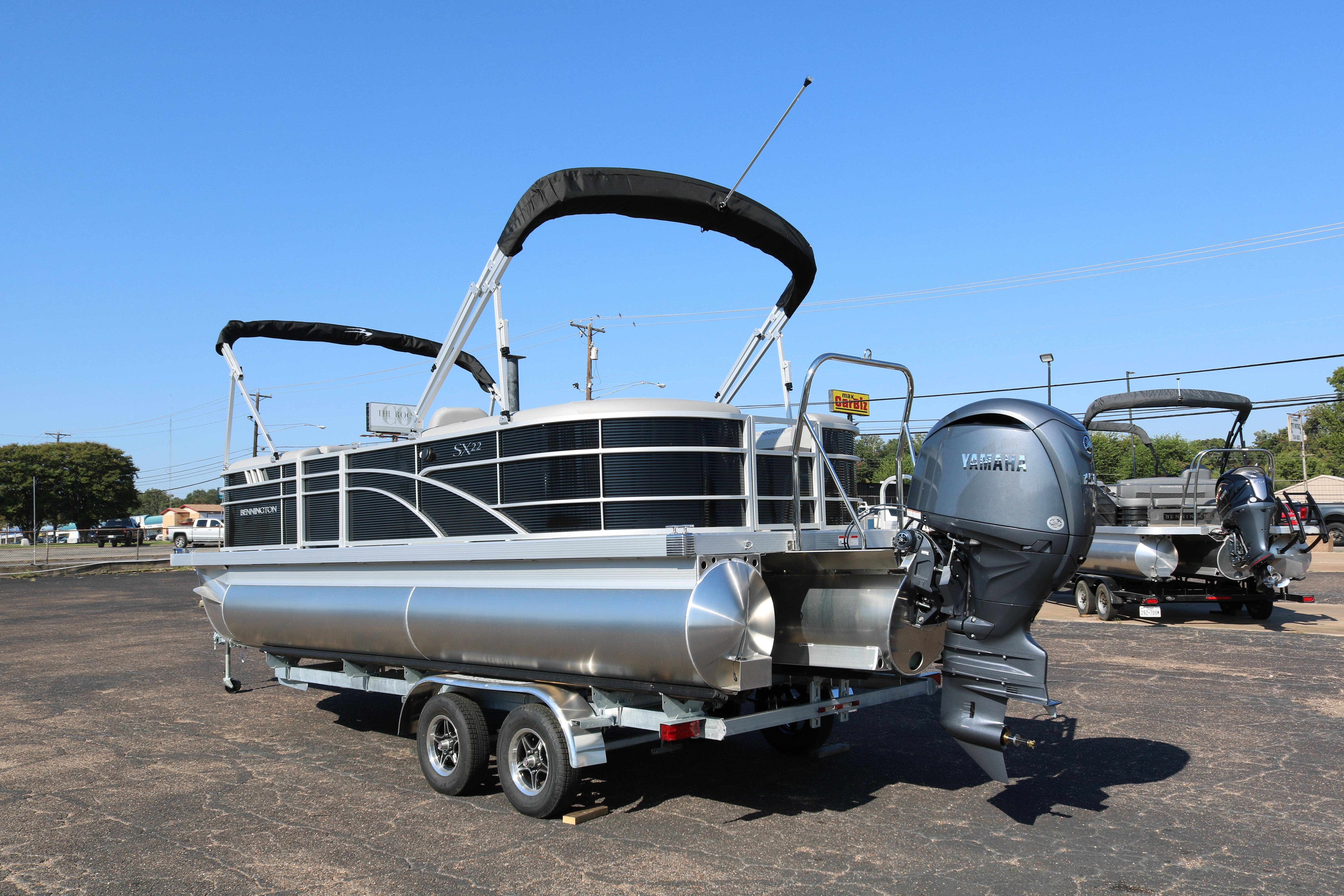 2026 Bennington 22SX Stern Radius pontoon boat with Yamaha outboard motor on trailer.