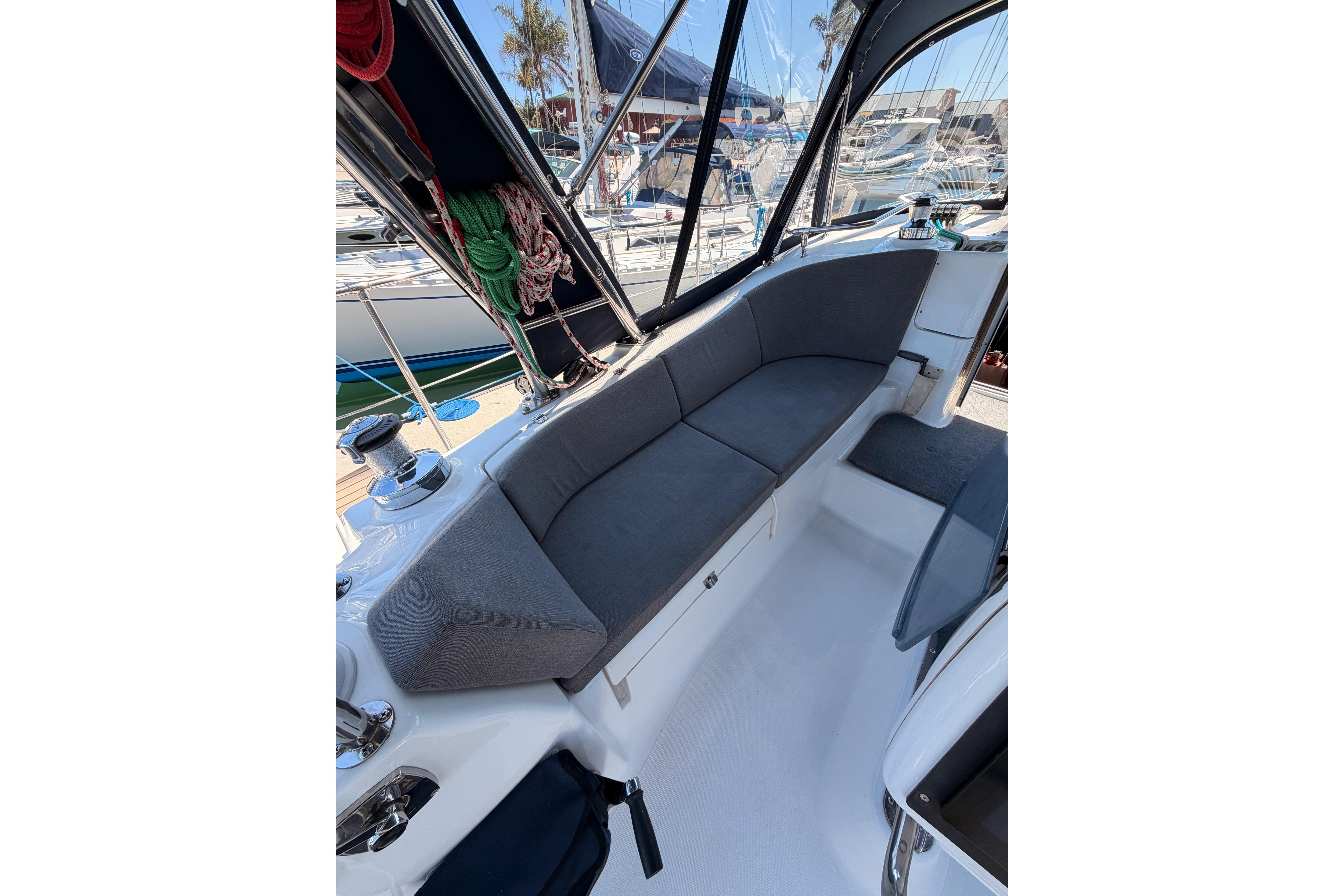 2008 Hunter 45 Deck Salon cockpit with cushioned seating and marina view.