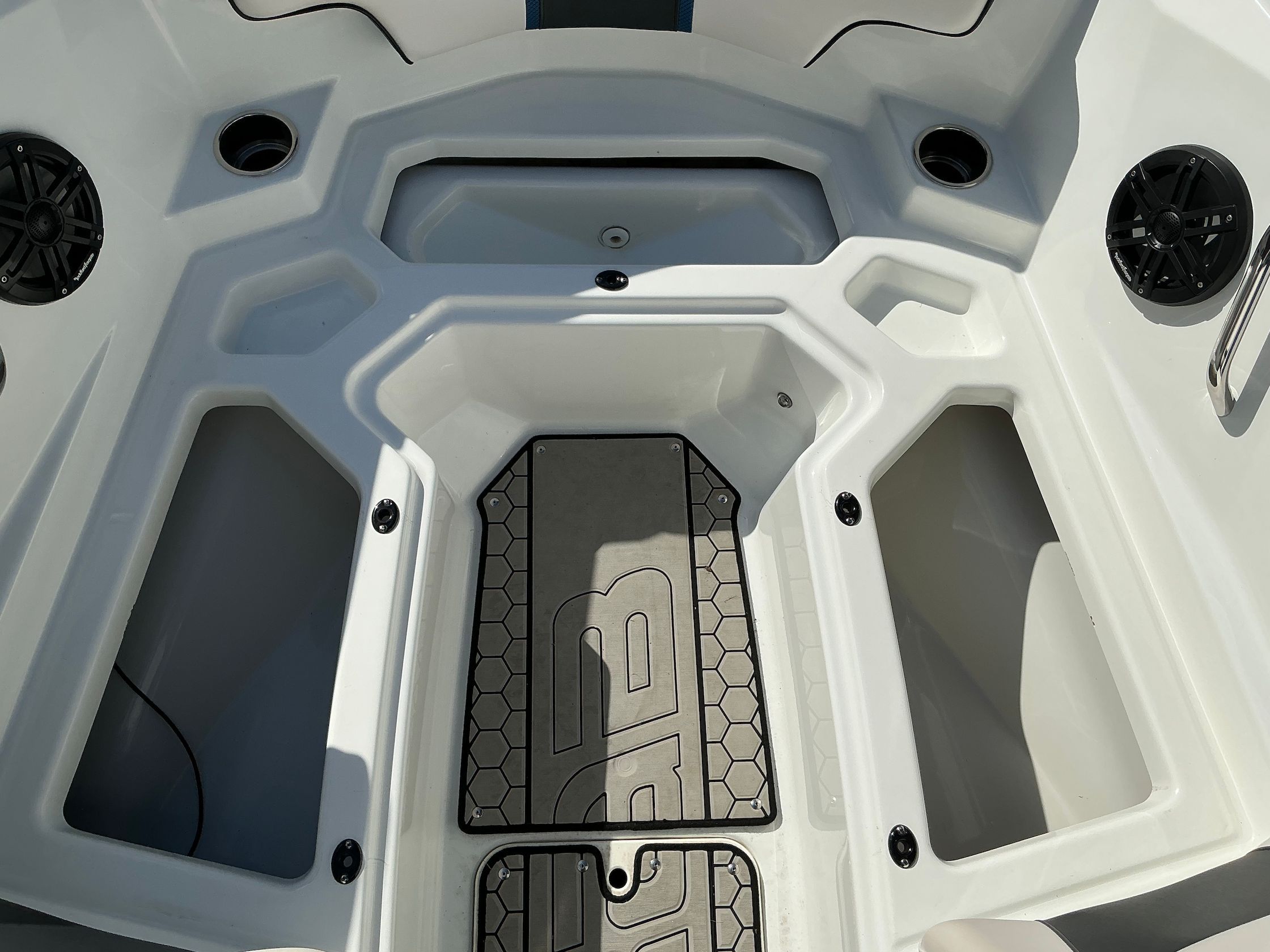Interior of a 2021 Scarab 215 ID boat with speakers.