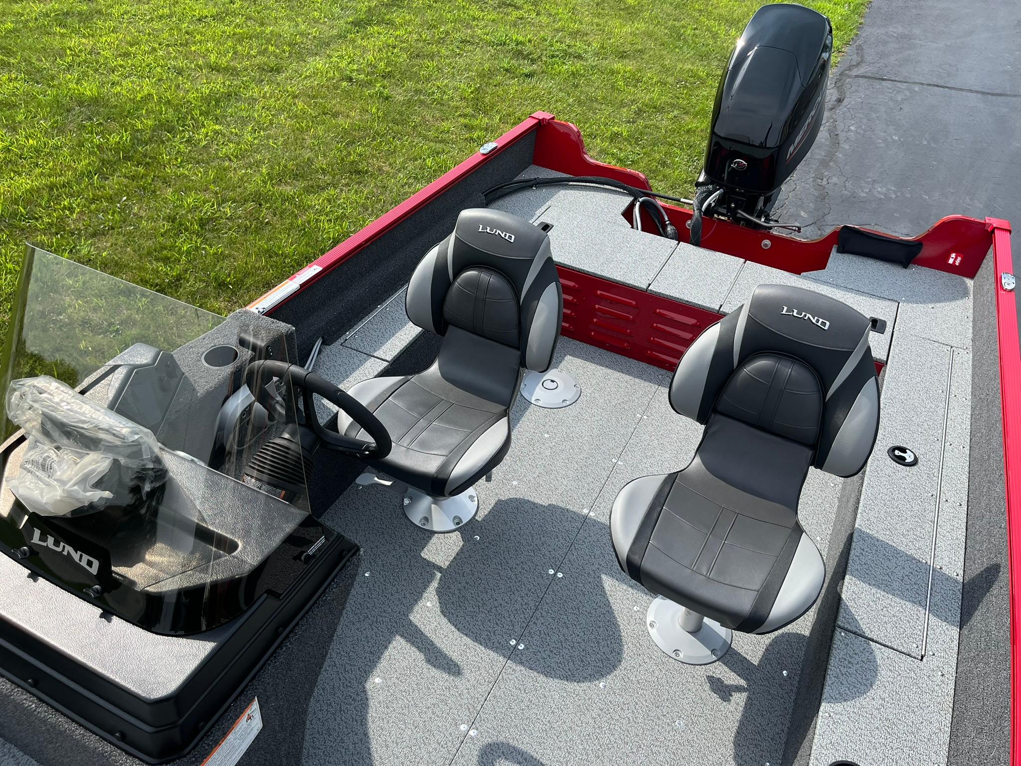 2026 Lund 1650 Angler SS boat interior with two seats and steering console.