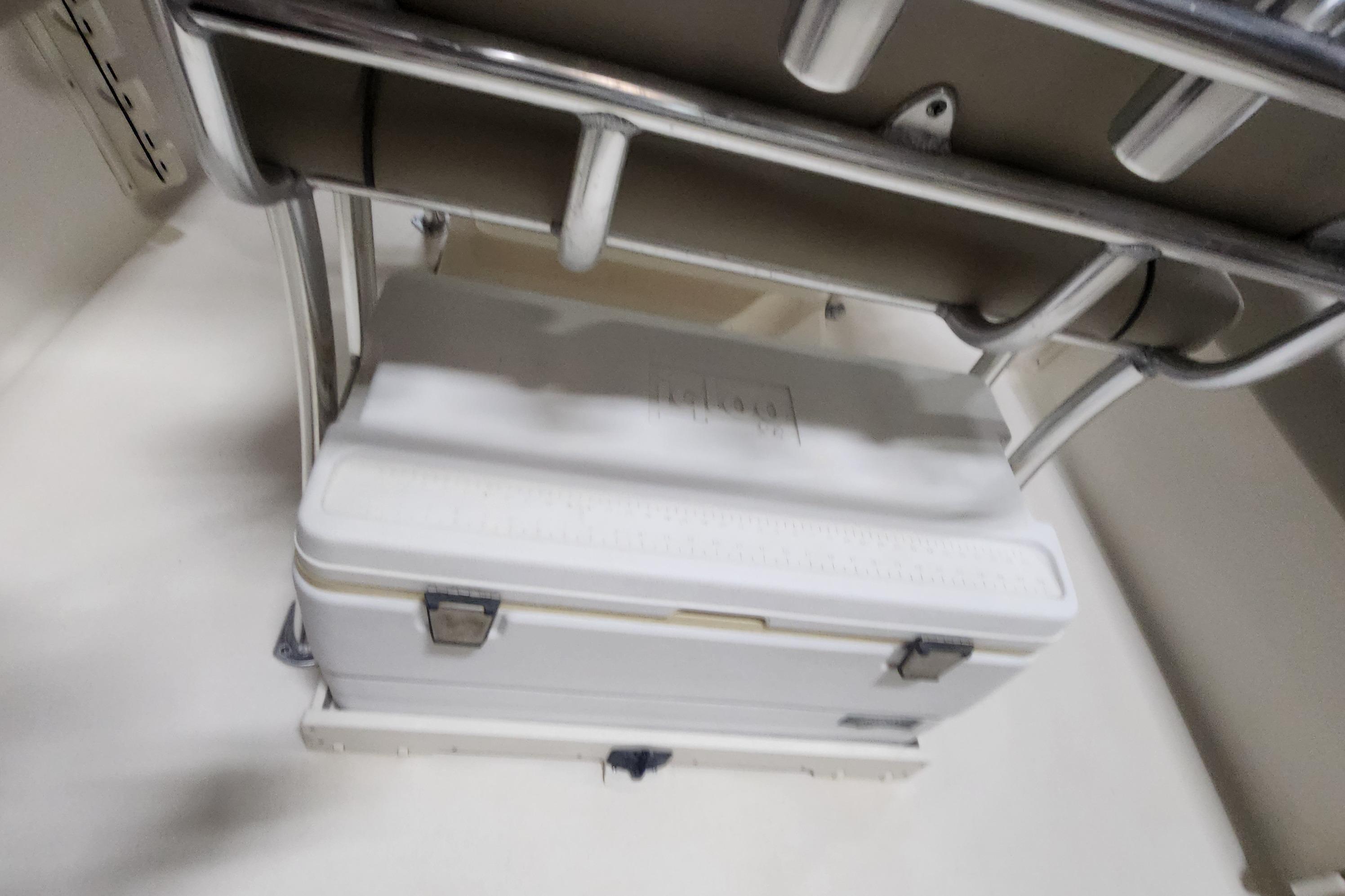 2023 Key West 219 FS boat interior with cooler storage under seat.