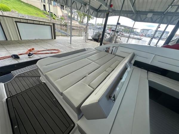2022 Cobalt A36BR boat interior with spacious seating under a covered dock.