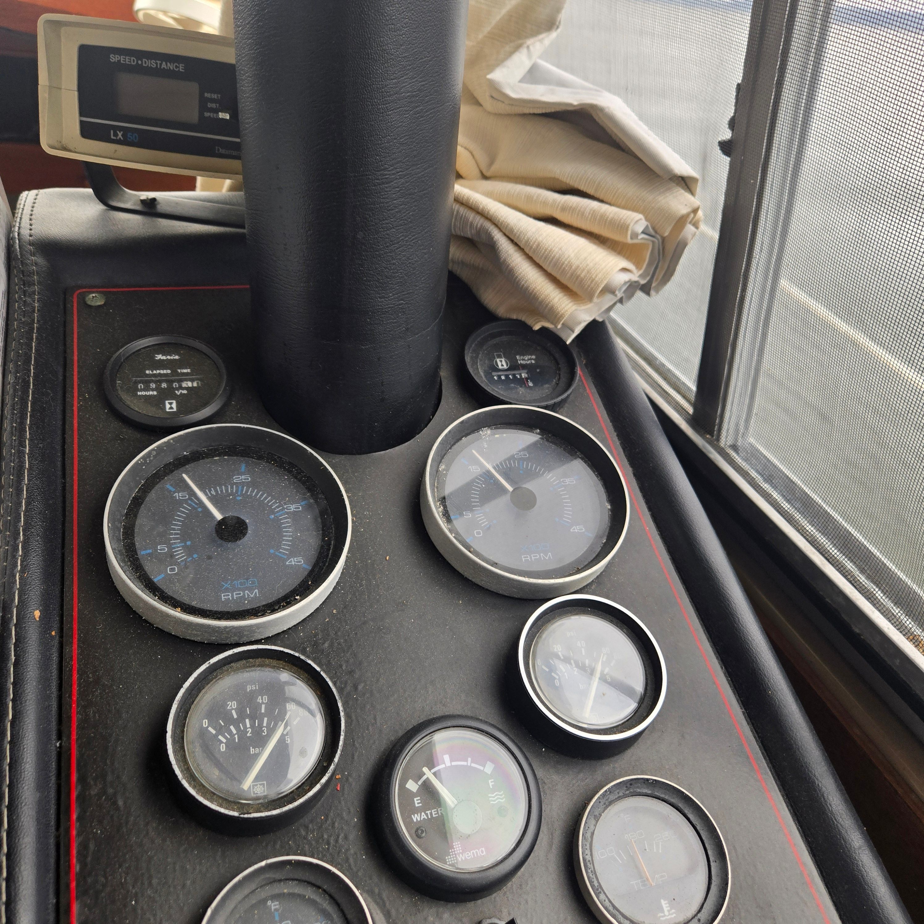 Dashboard of 1984 Bayliner 3870 Motoryacht with various gauges.