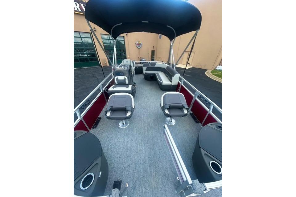 2026 Sun Tracker Bass Buggy 18 DLX pontoon boat with spacious seating and canopy.
