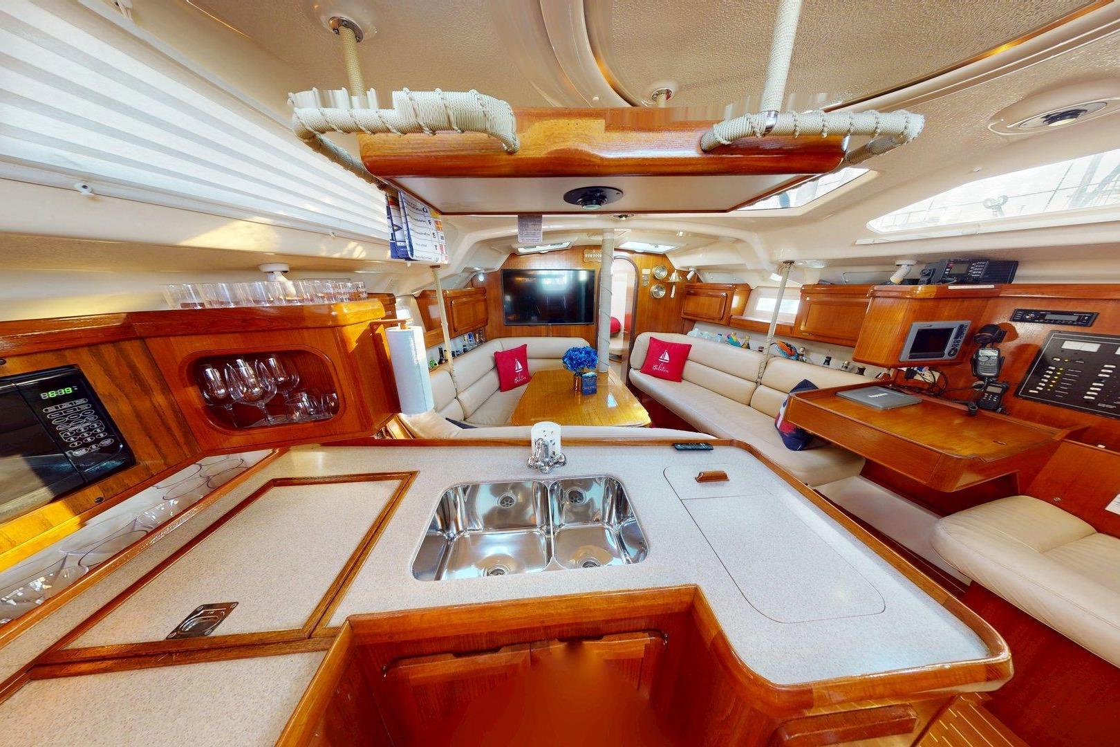 Luxurious interior of a 1997 Hunter Legend 40.5 yacht with elegant wood finishes.