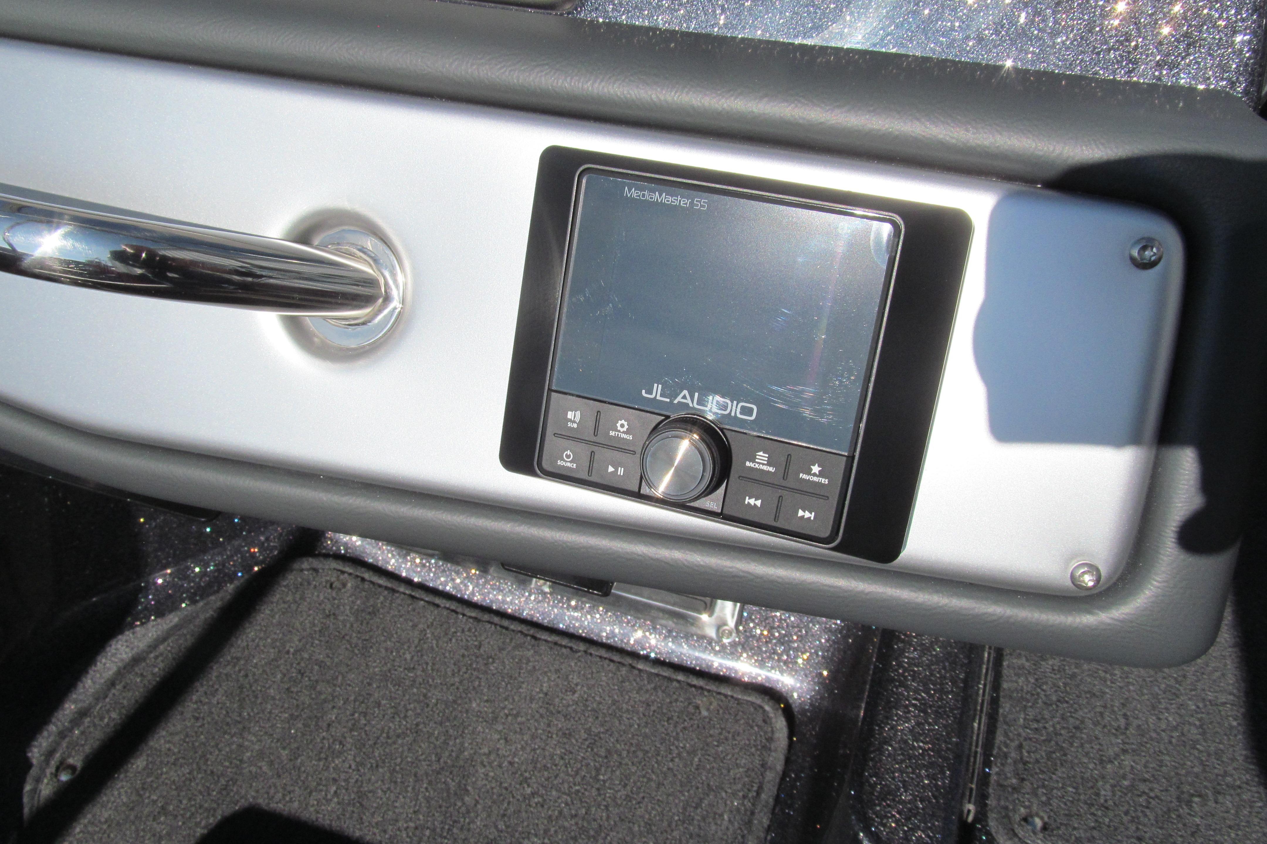 2026 Ranger 212LS boat dashboard featuring JL Audio system and sleek metallic handle.