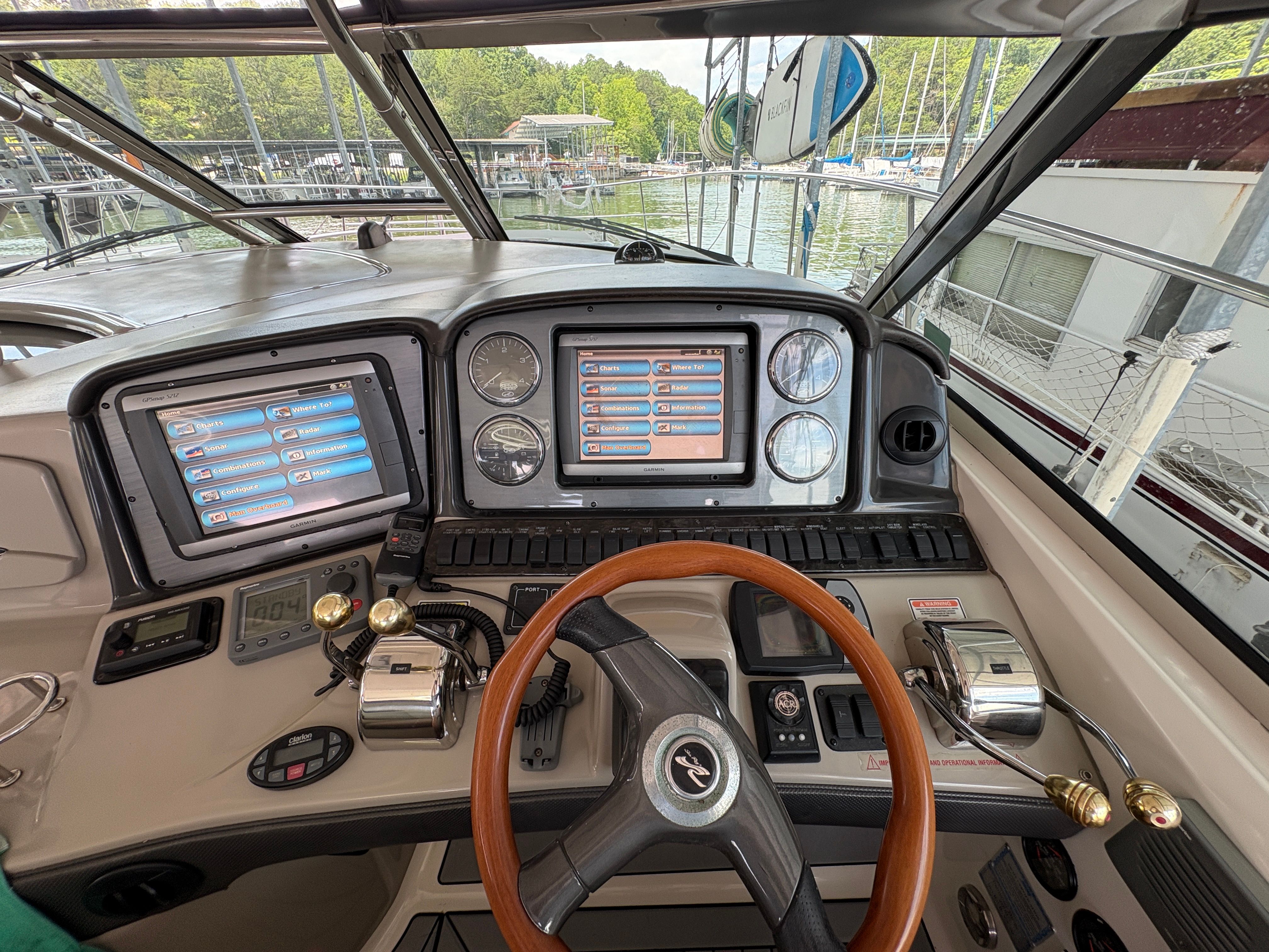 Helm of 2005 Sea Ray 420 Sundancer with modern instruments.