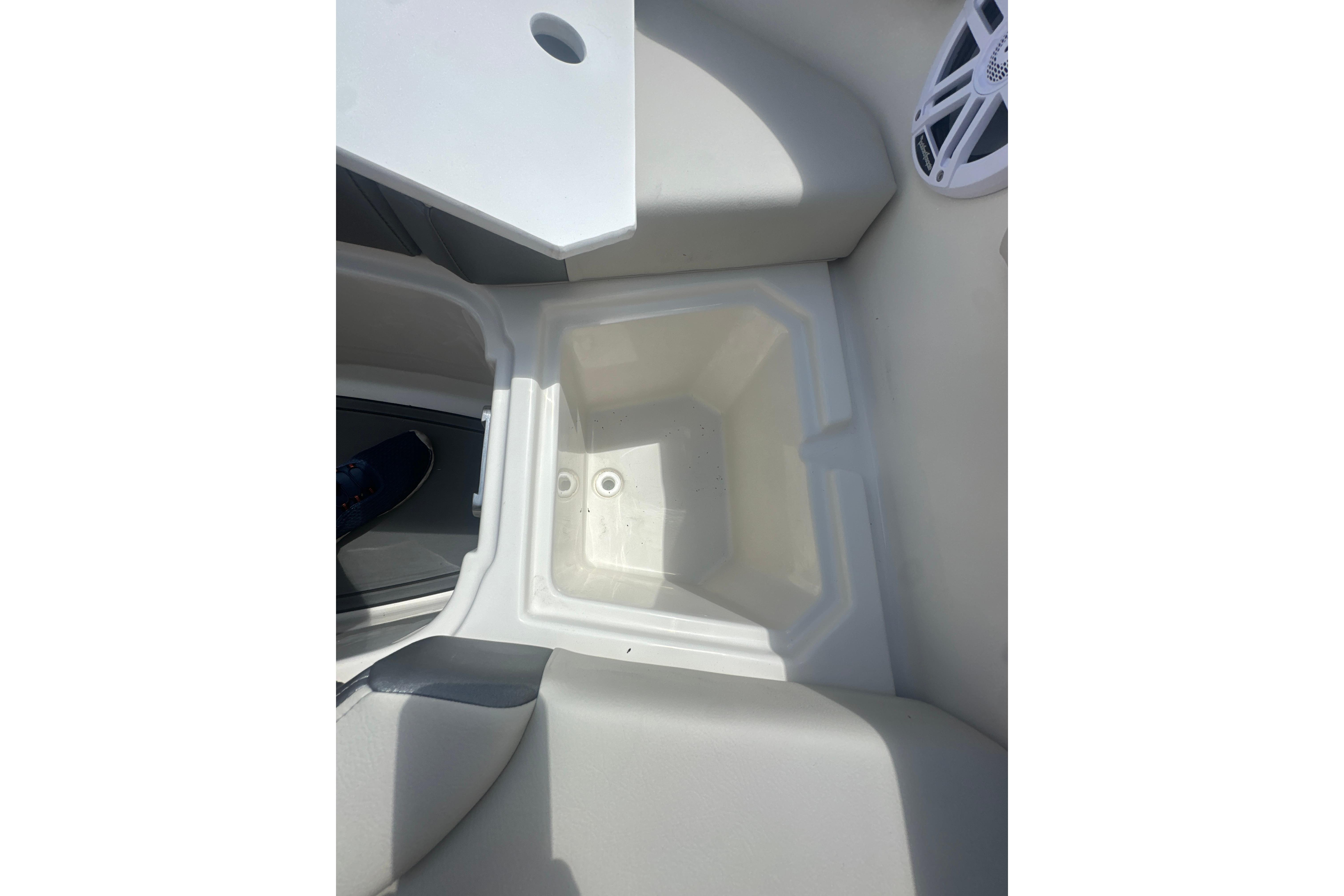 Interior view of 2026 Sailfish 226 DC boat, featuring a storage compartment.