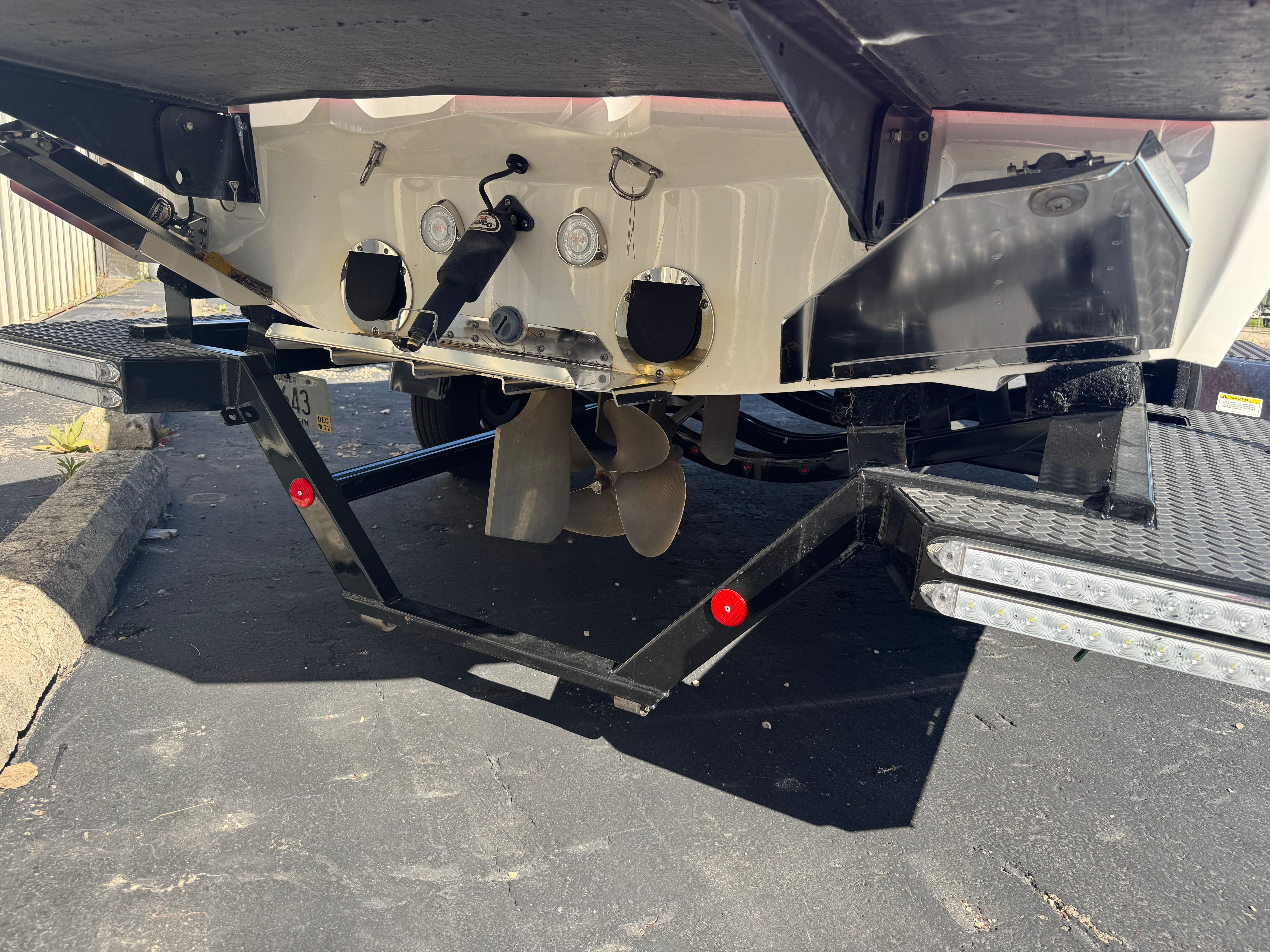 Rear view of a 2019 Master XT21 boat on a trailer.
