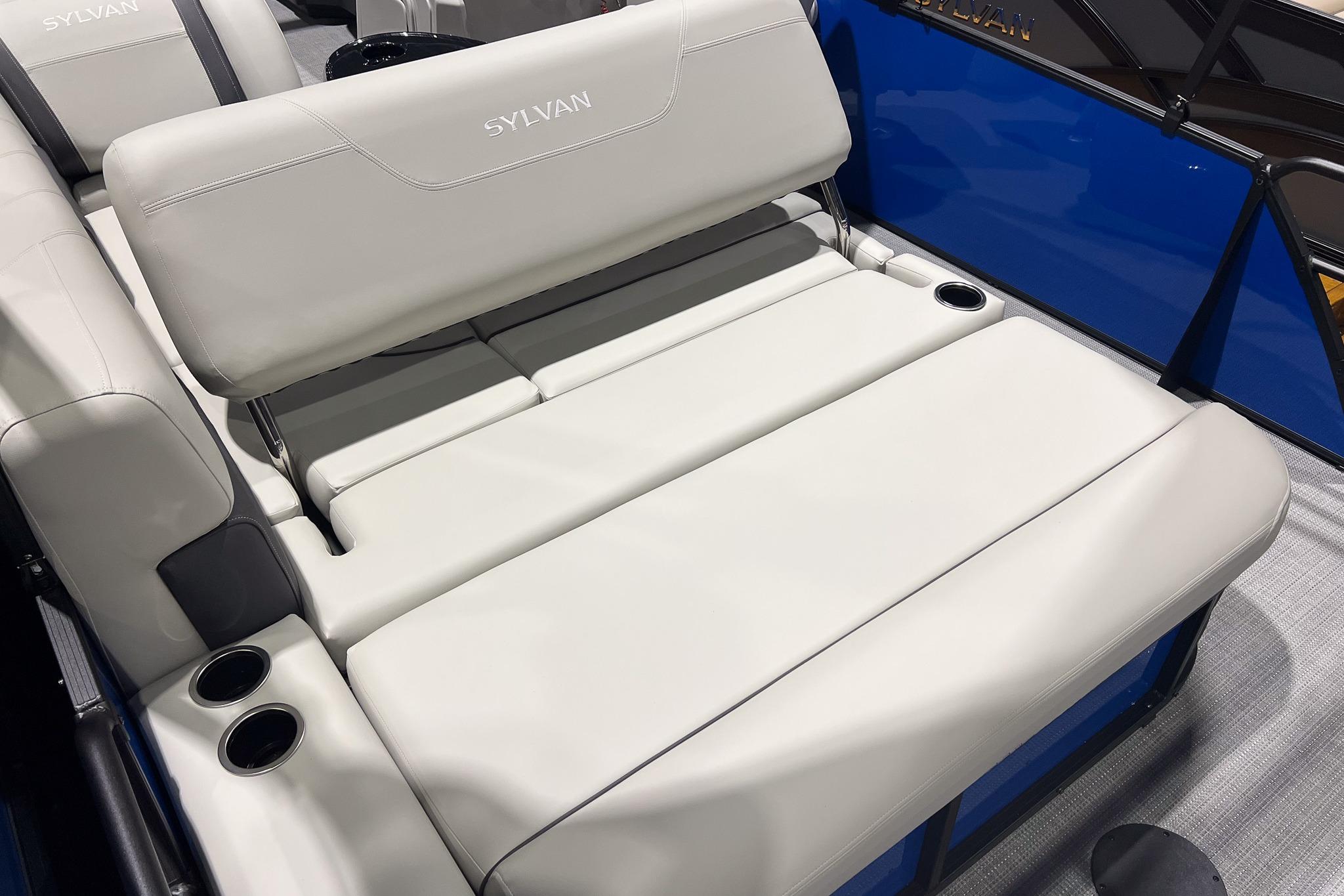 2026 Sylvan Mirage 822 CLZ boat interior with plush seating and cup holders.
