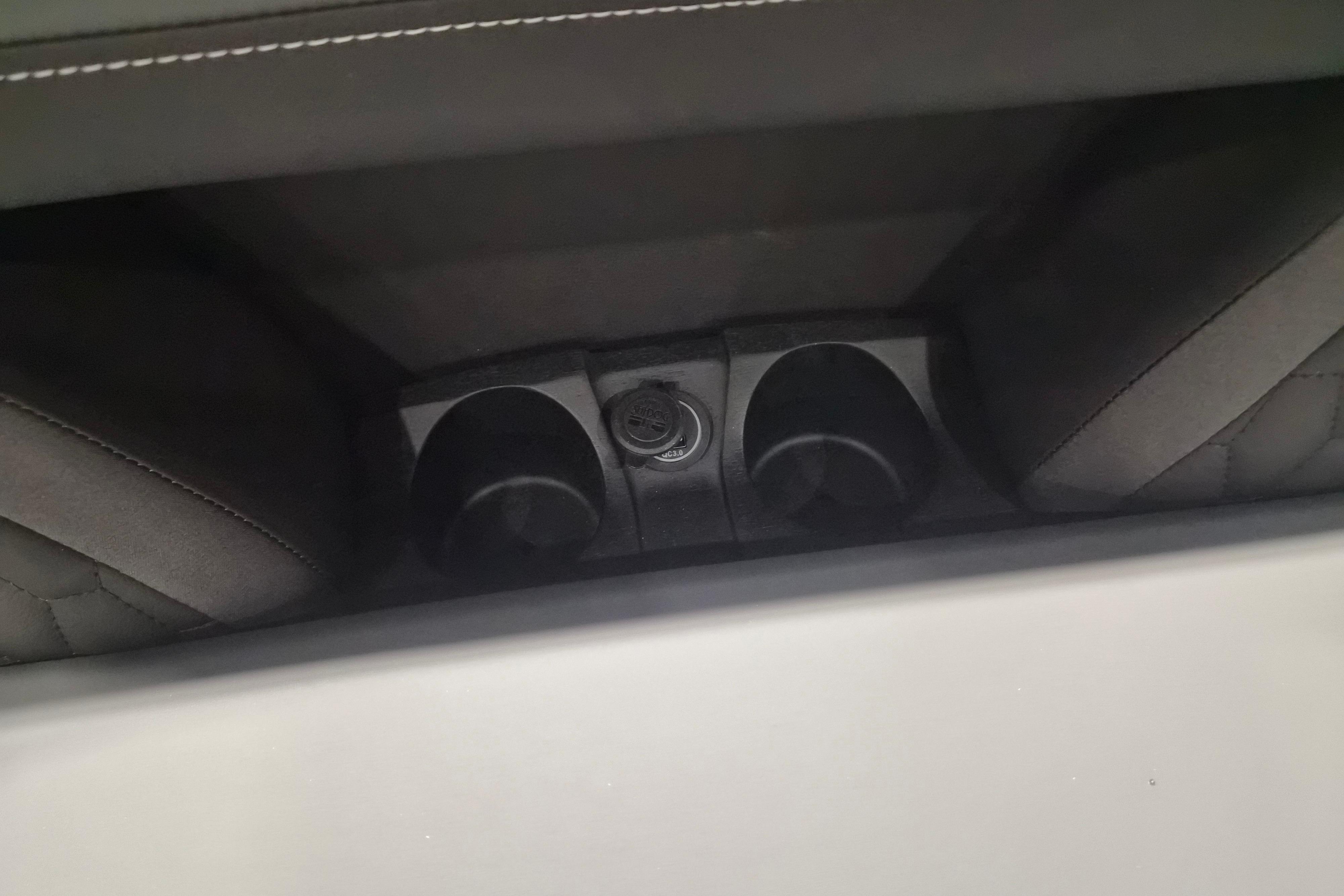 Interior cup holders and power outlet in 2026 Sylvan L3 ULZ vehicle.