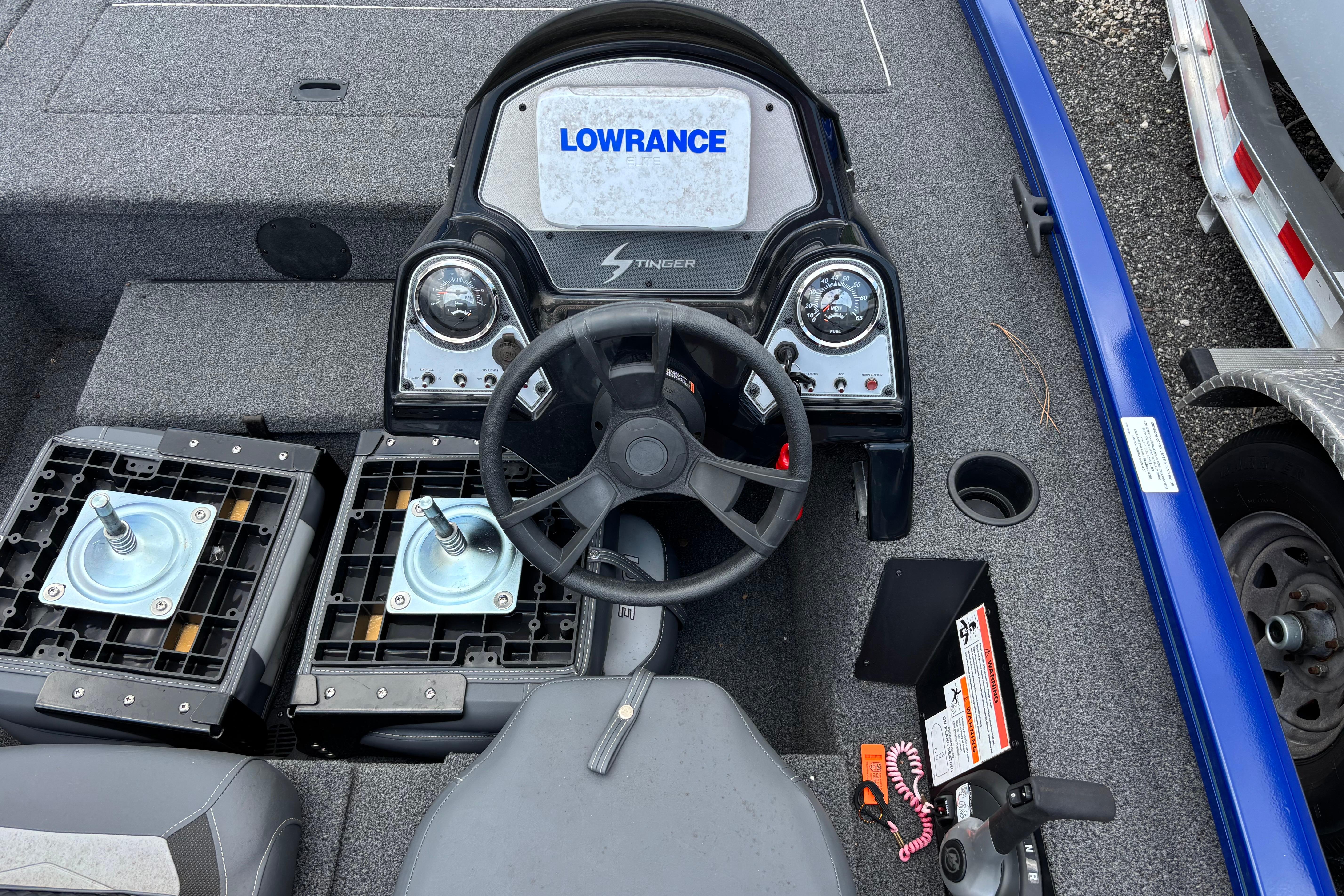 2021 Lowe Stinger 175C boat dashboard with steering wheel and control panel.
