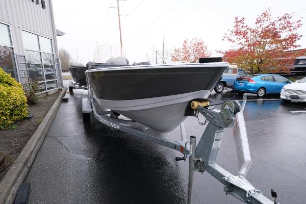 2024 Crestliner 1600 Vision boat on trailer in parking lot.