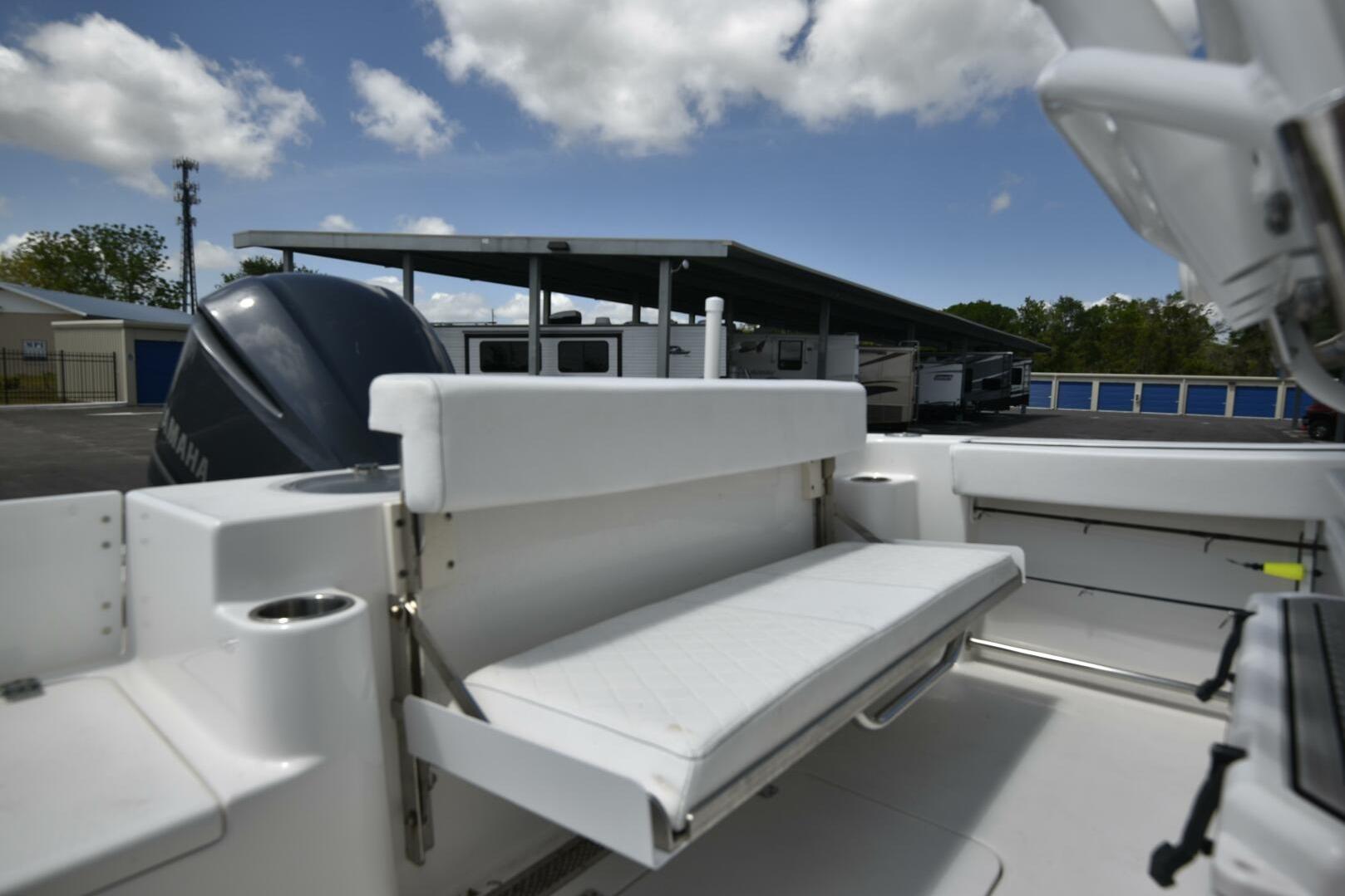 2023 Sea Pro 239 Deep V CC boat with foldable seating and Yamaha engine.