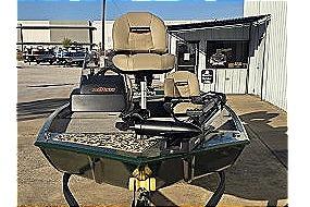 2026 Tracker Bass Tracker Classic Limited boat with seating, parked outdoors.