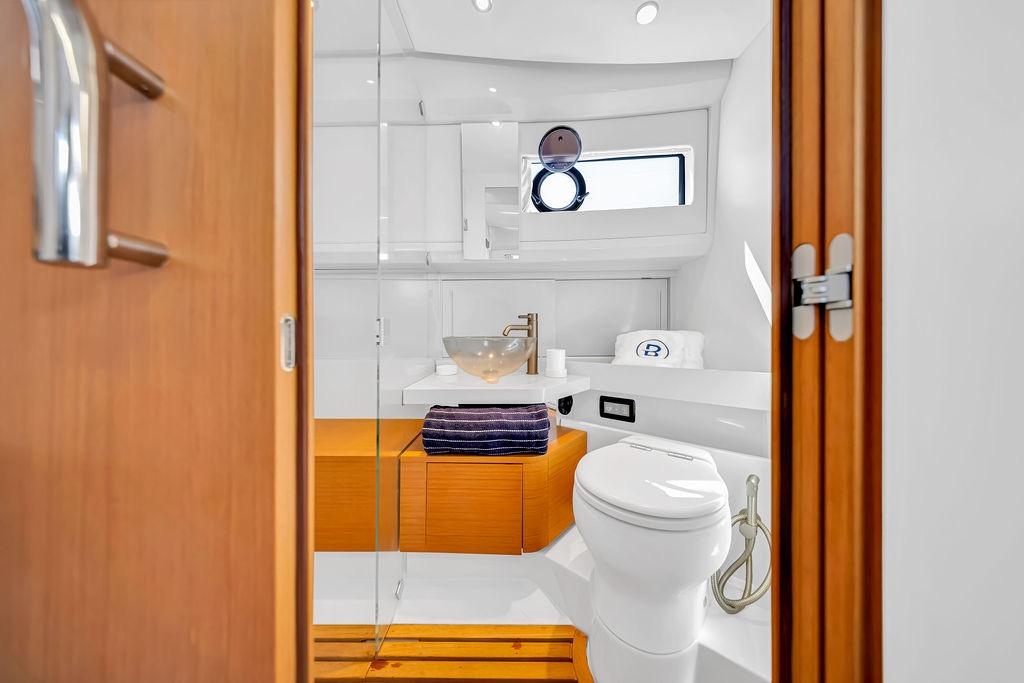 Luxurious bathroom interior of 2021 Bluegame BG 42 yacht, featuring modern fixtures and elegant design.