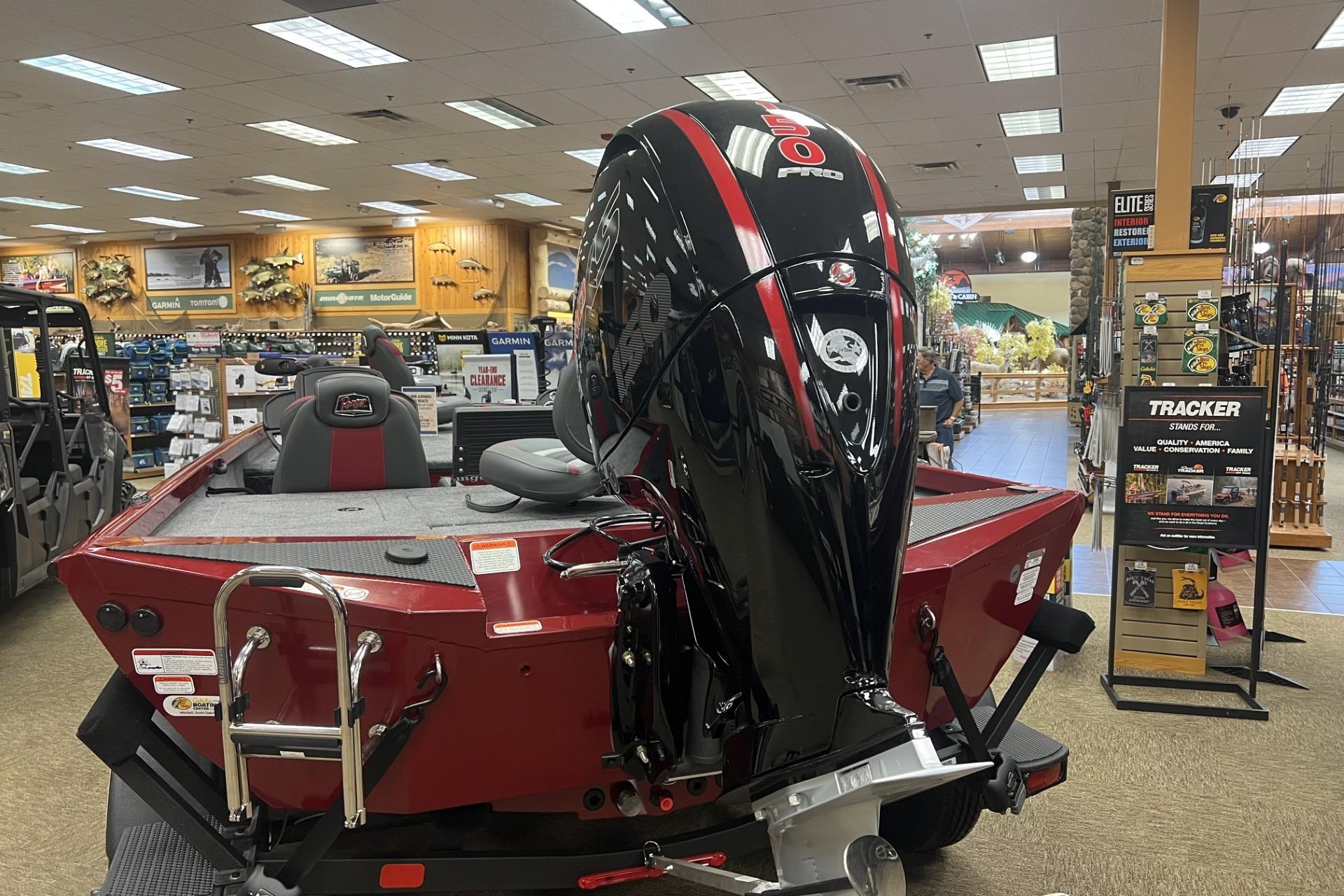 2026 Ranger RT198P boat with powerful engine displayed in a showroom.