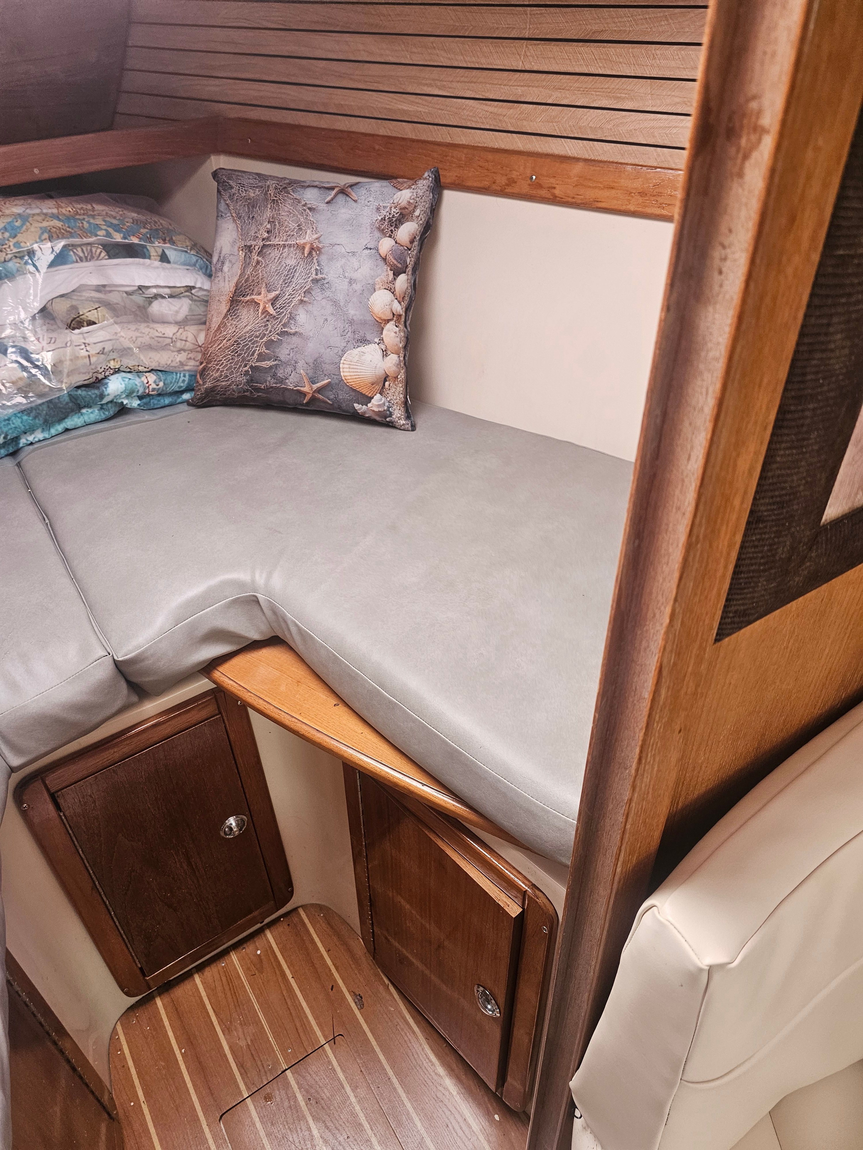 Interior of a Catalina 320 yacht with cozy cabin.
