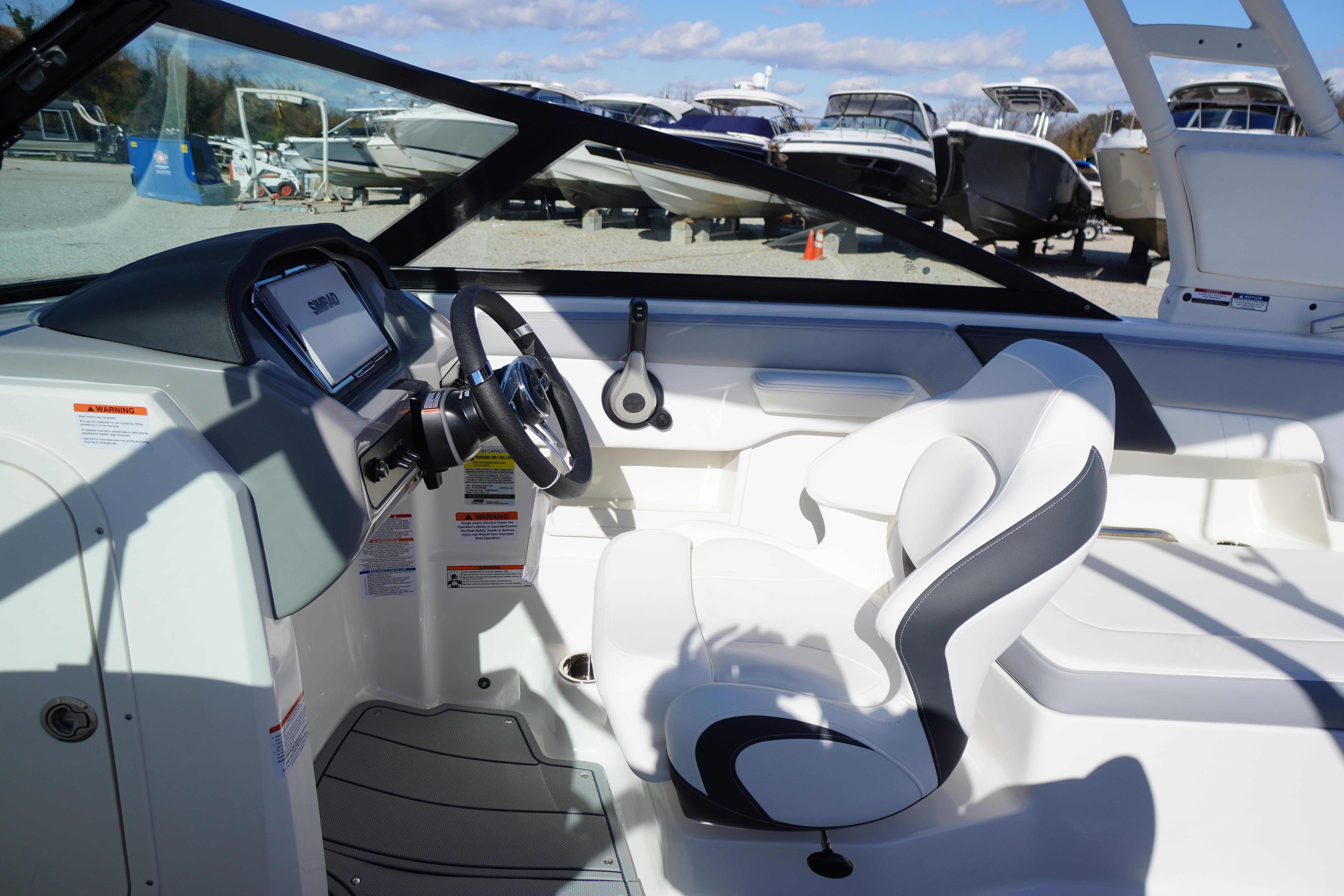 Interior of 2026 Chaparral 23 SSi OB boat with modern steering and seating.