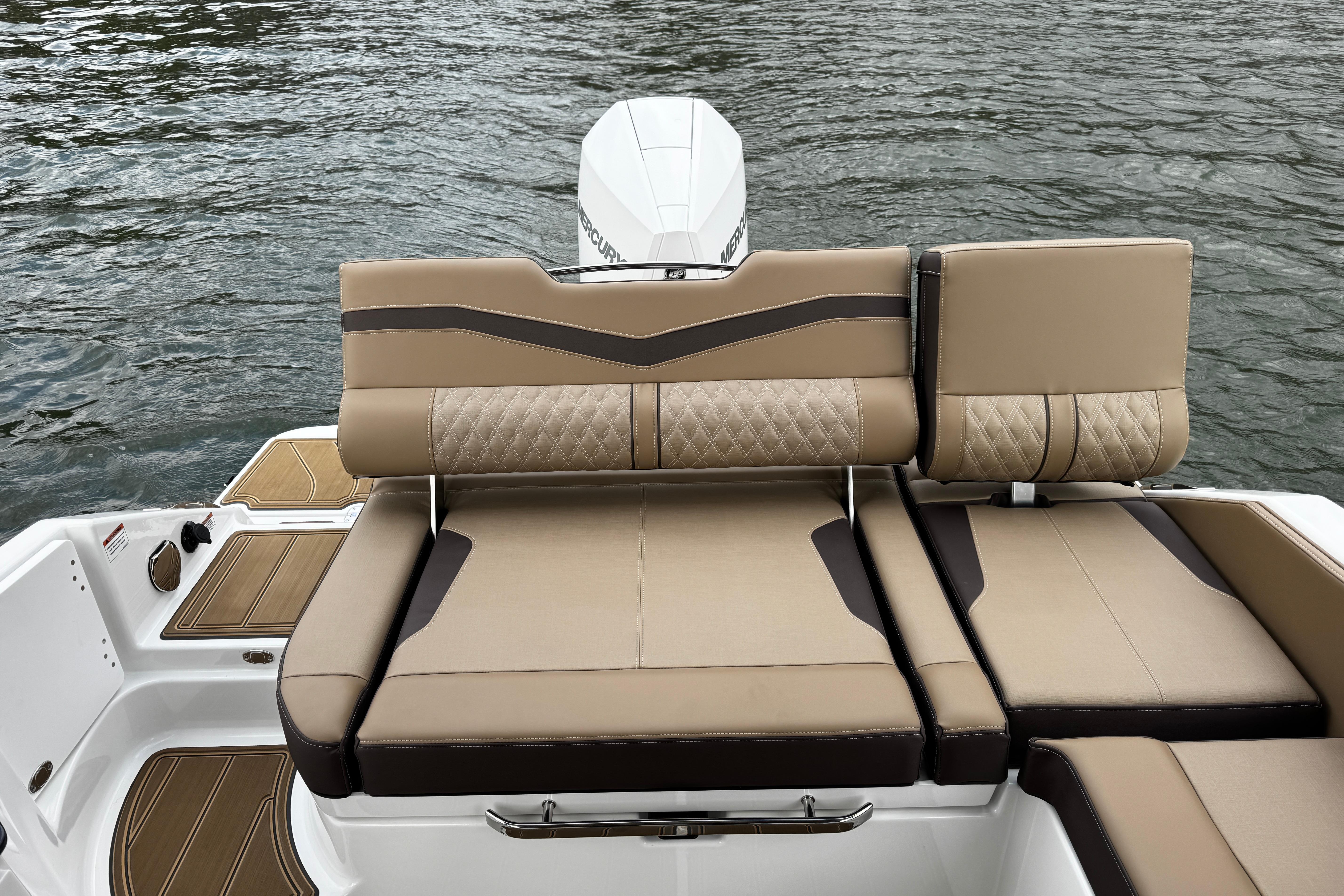 2026 Monterey Elite 25 OB boat with luxurious tan seating on water.