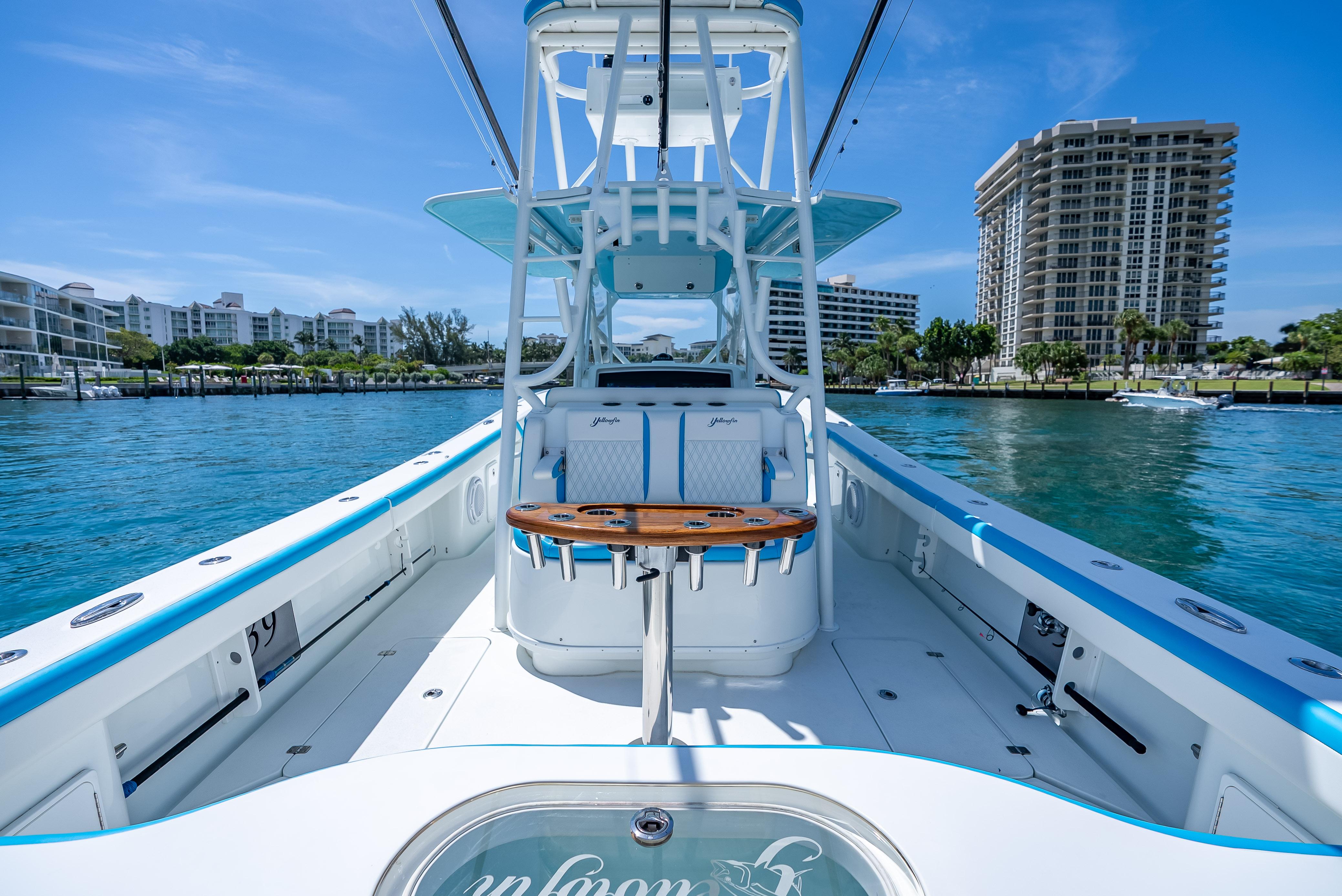 2016 Yellowfin 39 Offshore boat on water, with modern design and cityscape background.