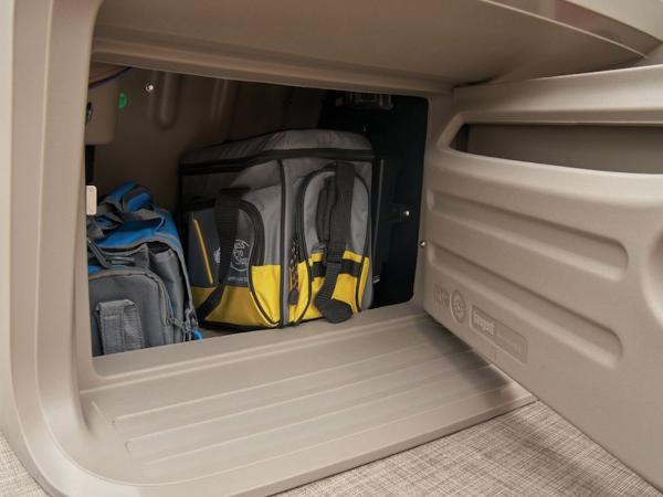 Storage compartment of 2024 Sun Tracker PARTY BARGE® 18 DLX with bags inside.