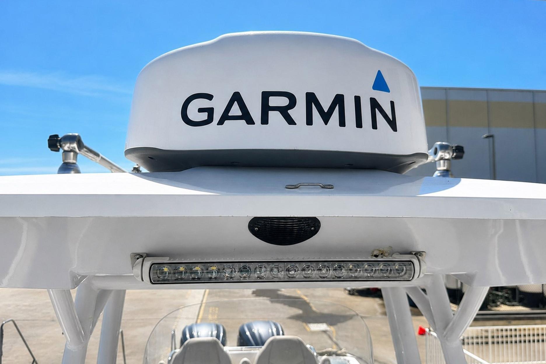 Garmin radar on 2002 Sea Fox 228 Commander boat under clear blue sky.