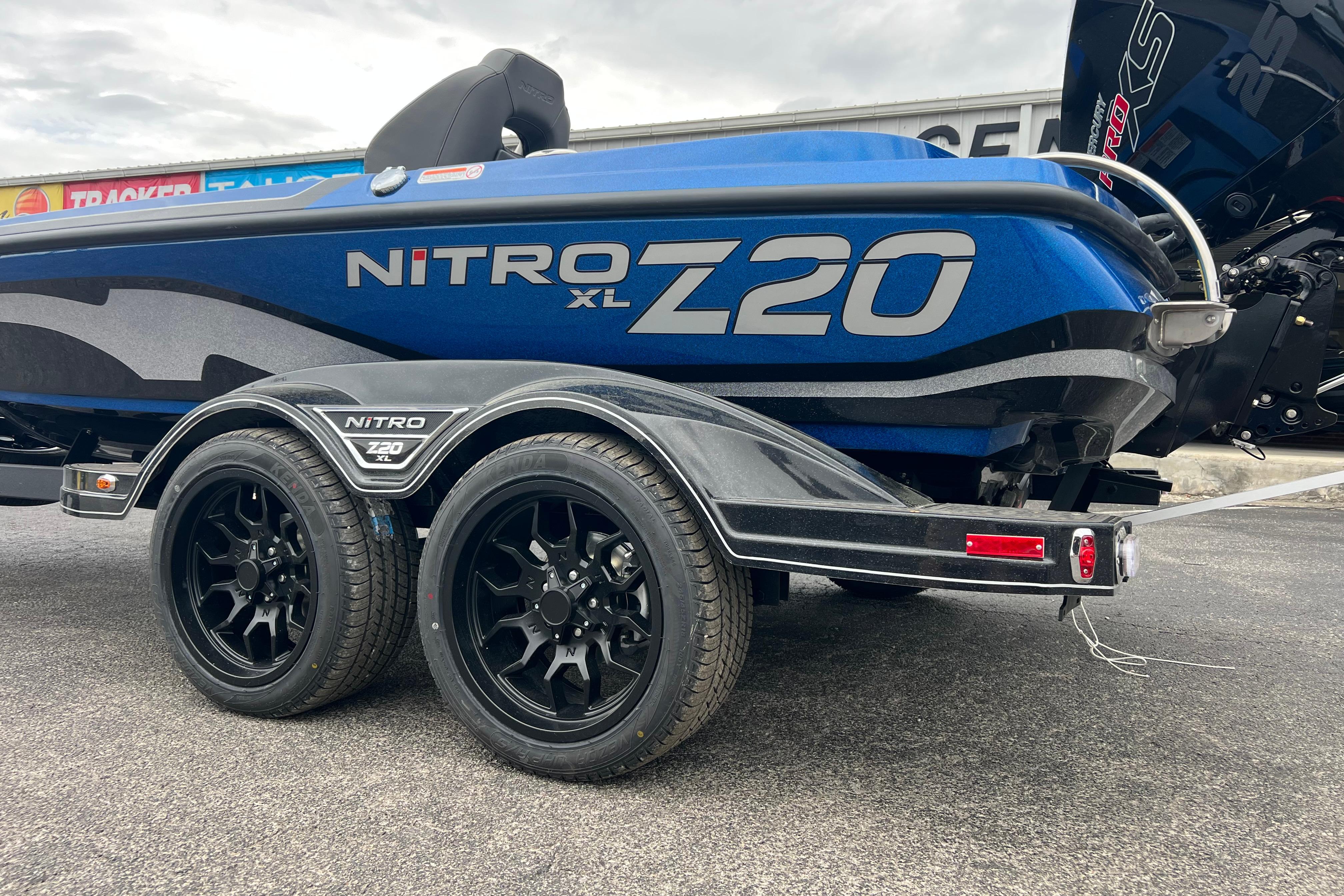 2026 Nitro Z20 XL Pro boat on trailer, featuring sleek design and dual black wheels.