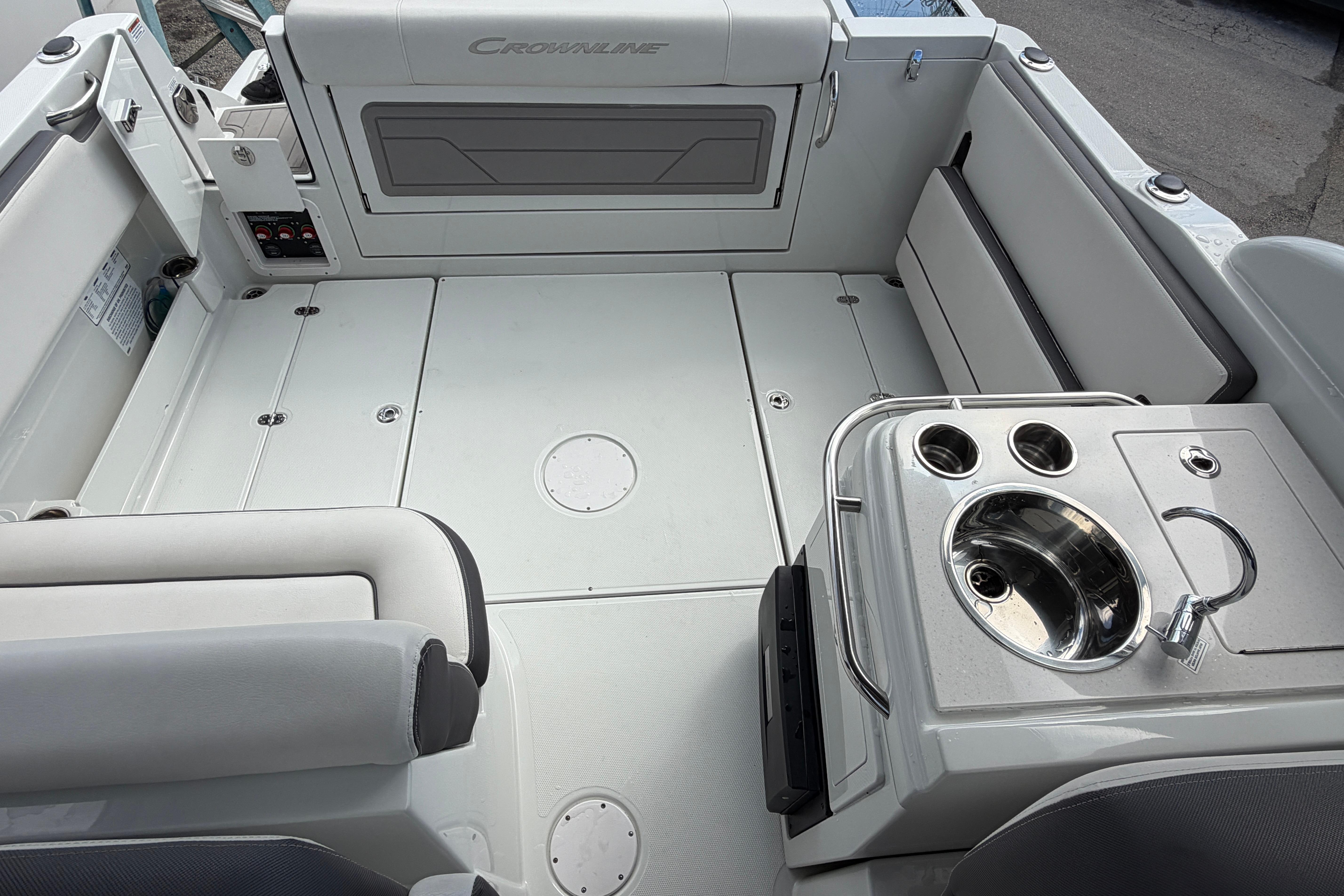 2024 Crownline 260 DC Finseeker boat interior with seating and sink.