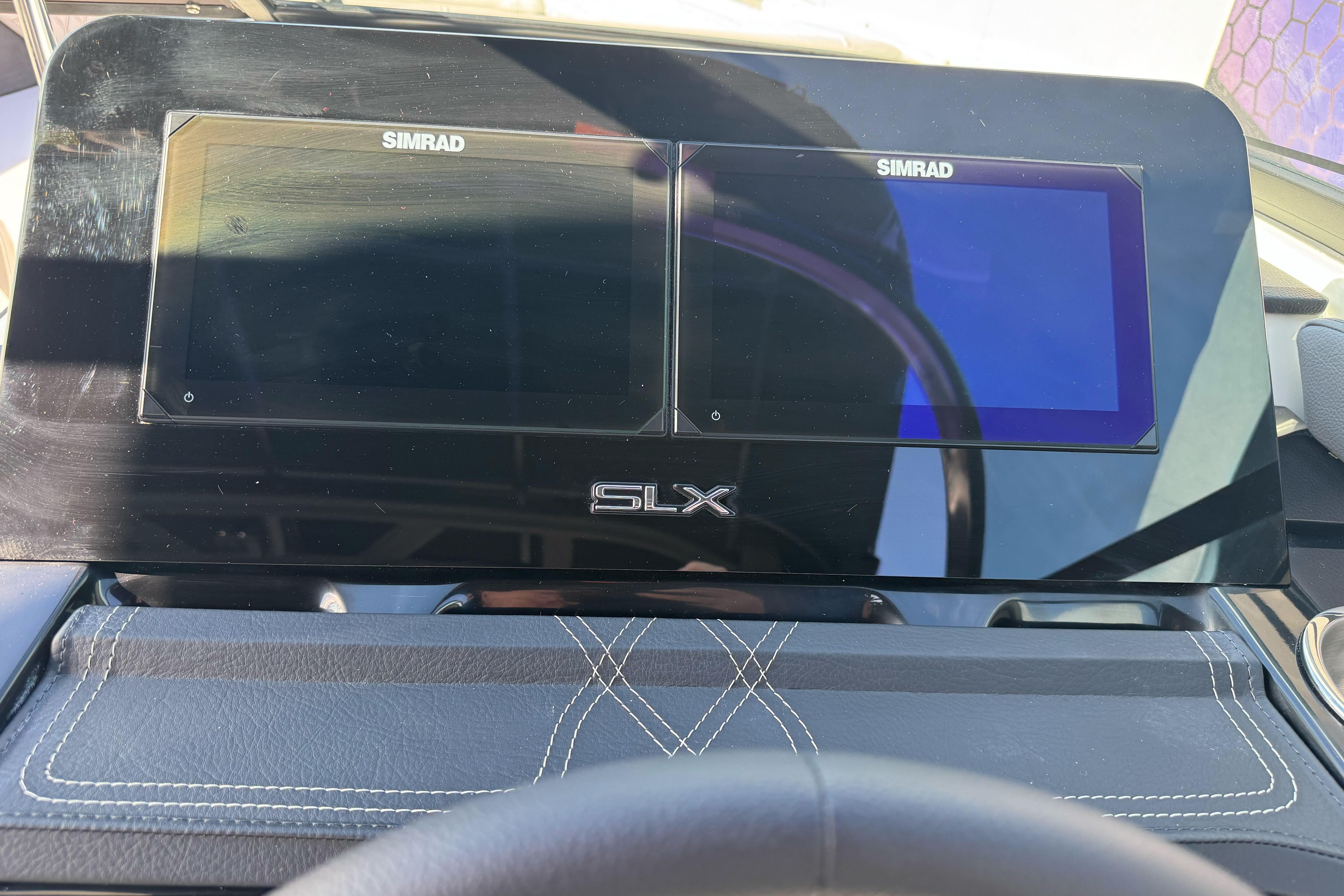 Dashboard of 2026 Sea Ray SLX 260 with dual Simrad displays.