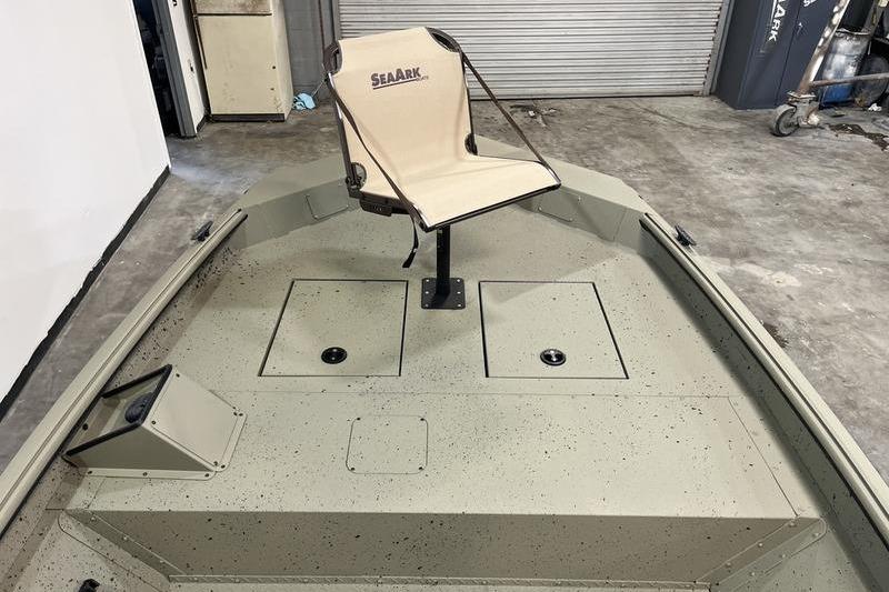 2025 SeaArk Shadow 18T boat interior with swivel seat and storage compartments.