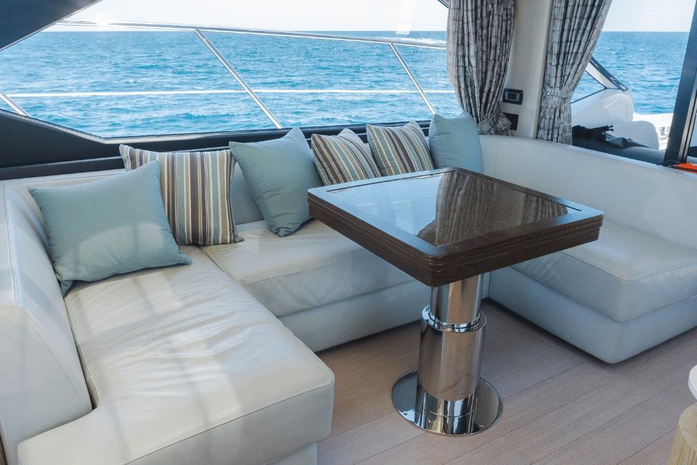 Luxurious interior of 2020 Azimut 60 yacht with elegant seating and ocean view.