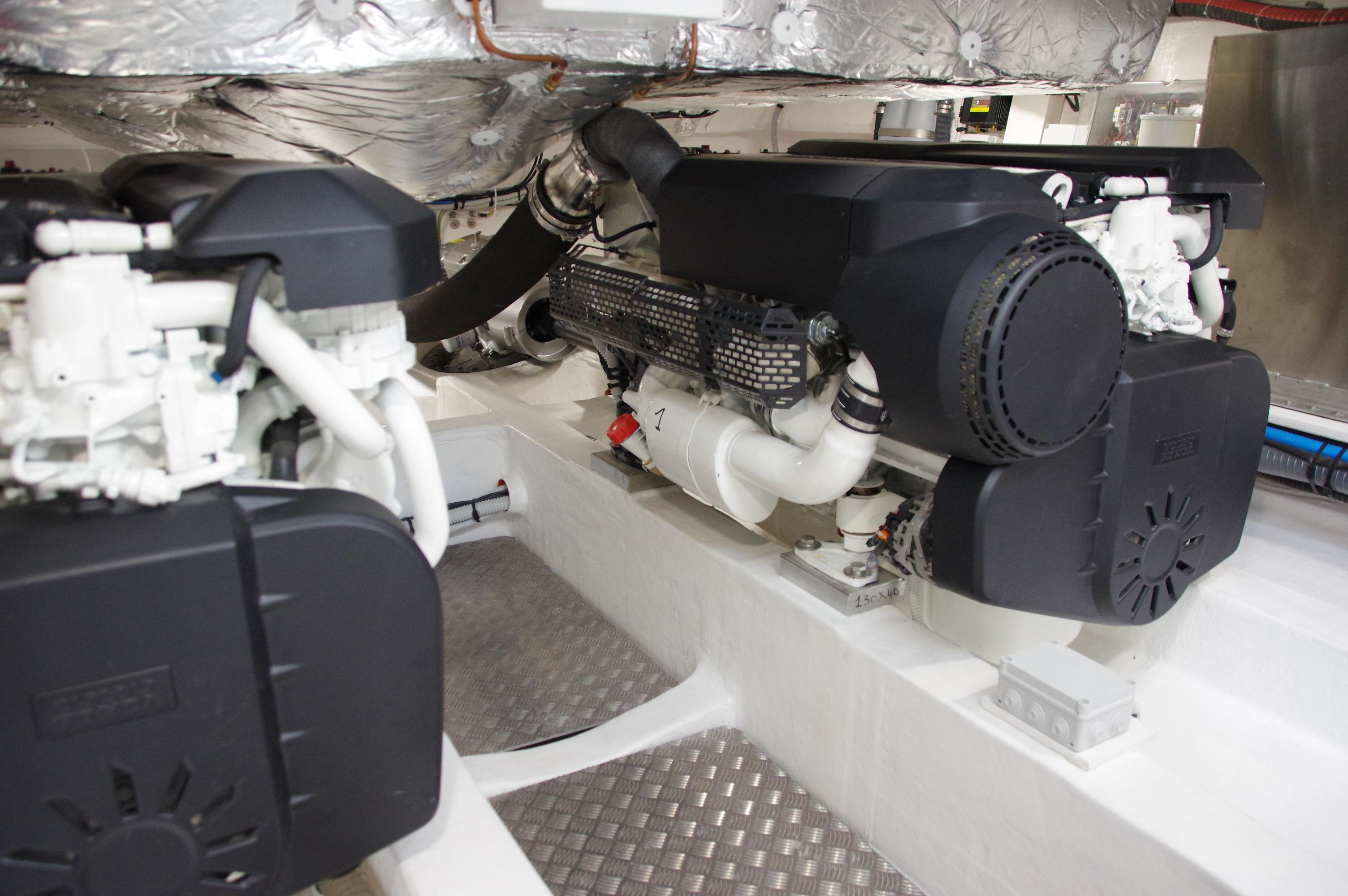 Engine room of 2025 Pardo Yachts 50, showcasing dual engines and mechanical components.