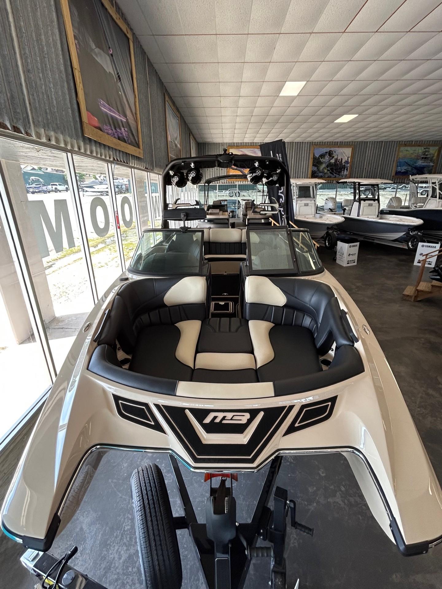 2024 MB F22 Tomcat boat displayed in showroom, featuring sleek design and modern interior.