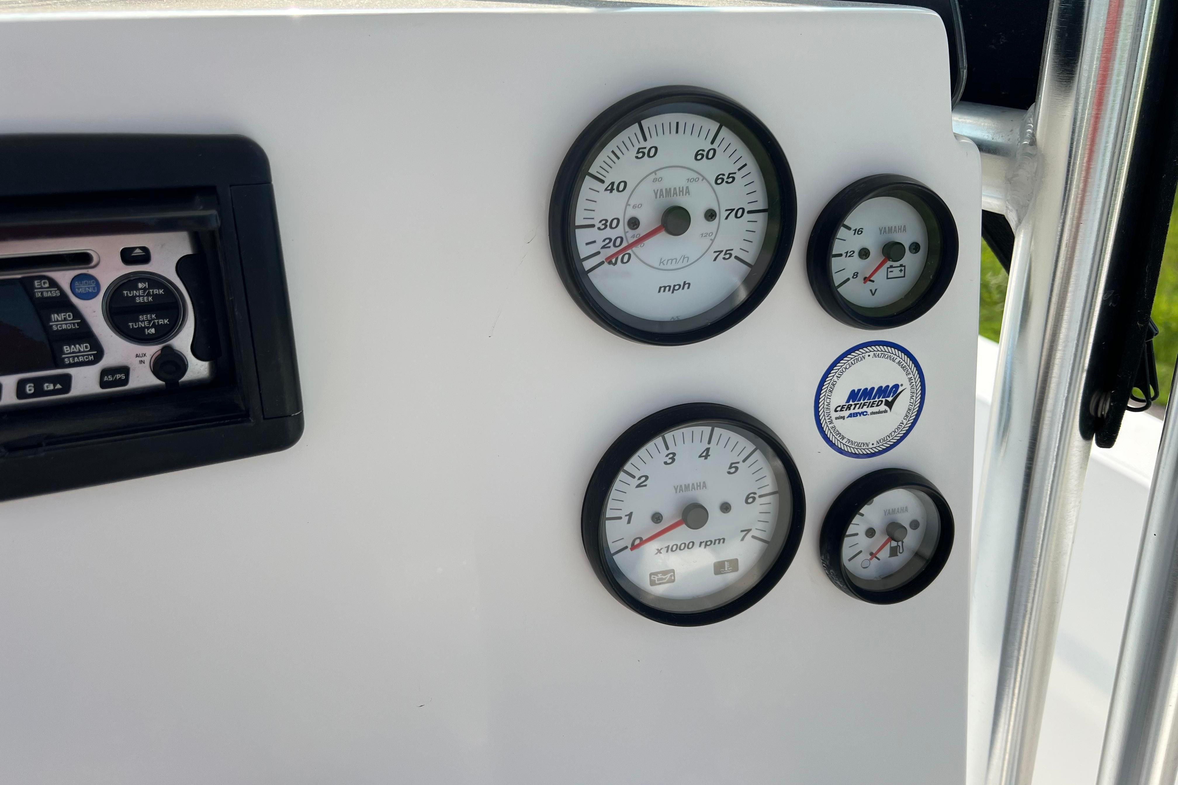 Dashboard of a 2012 Sea Fox 206 Center Console with Yamaha gauges and stereo system.