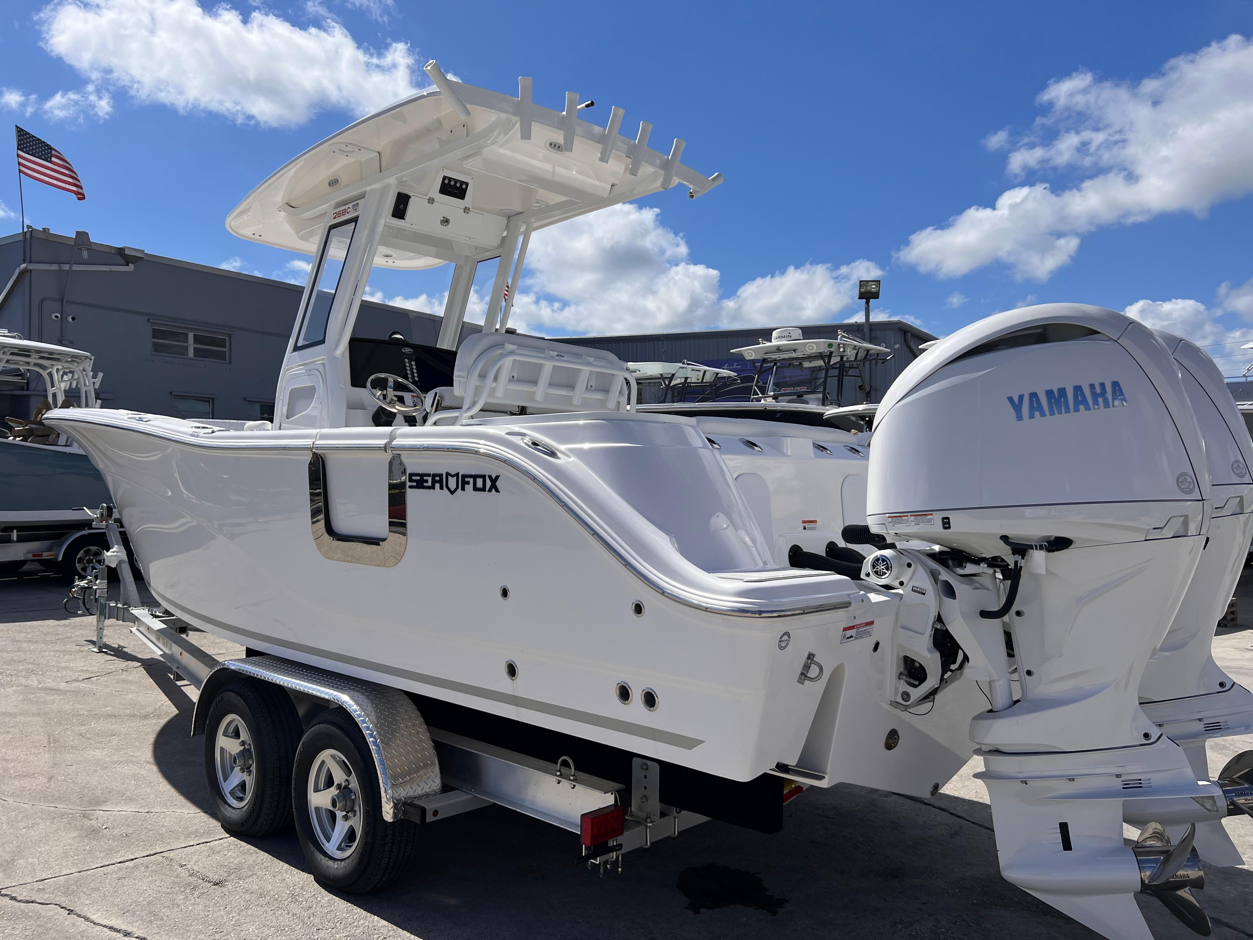 2025 Sea Fox 268 Commander boat with Yamaha engine on trailer, under clear blue sky.