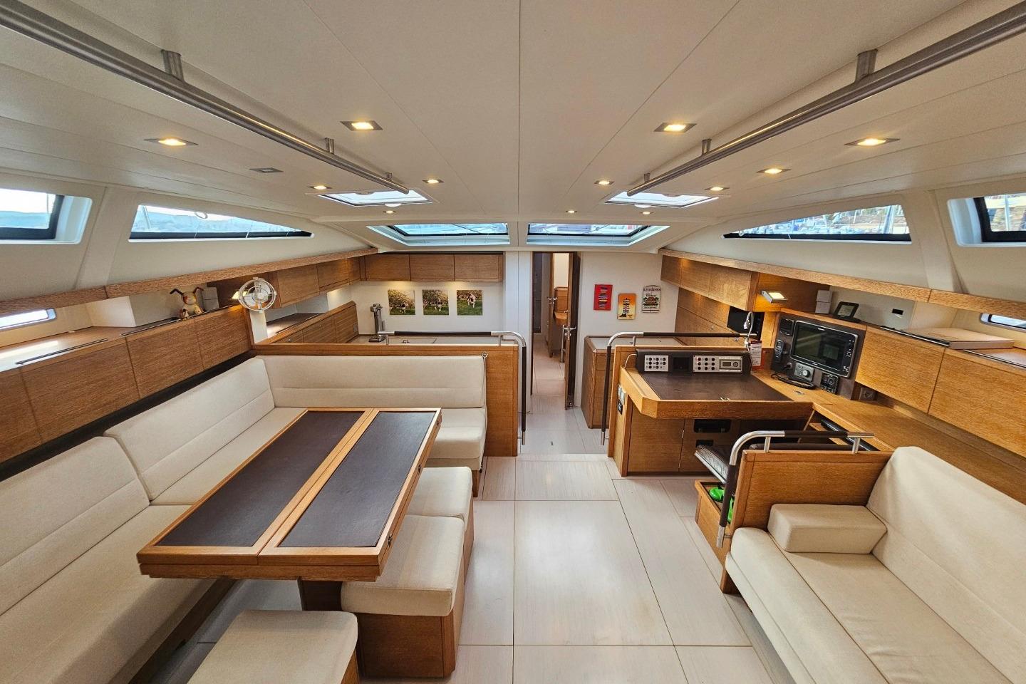 Luxurious interior of 2013 CNB BORDEAUX 60 yacht with modern furnishings and ample natural light.