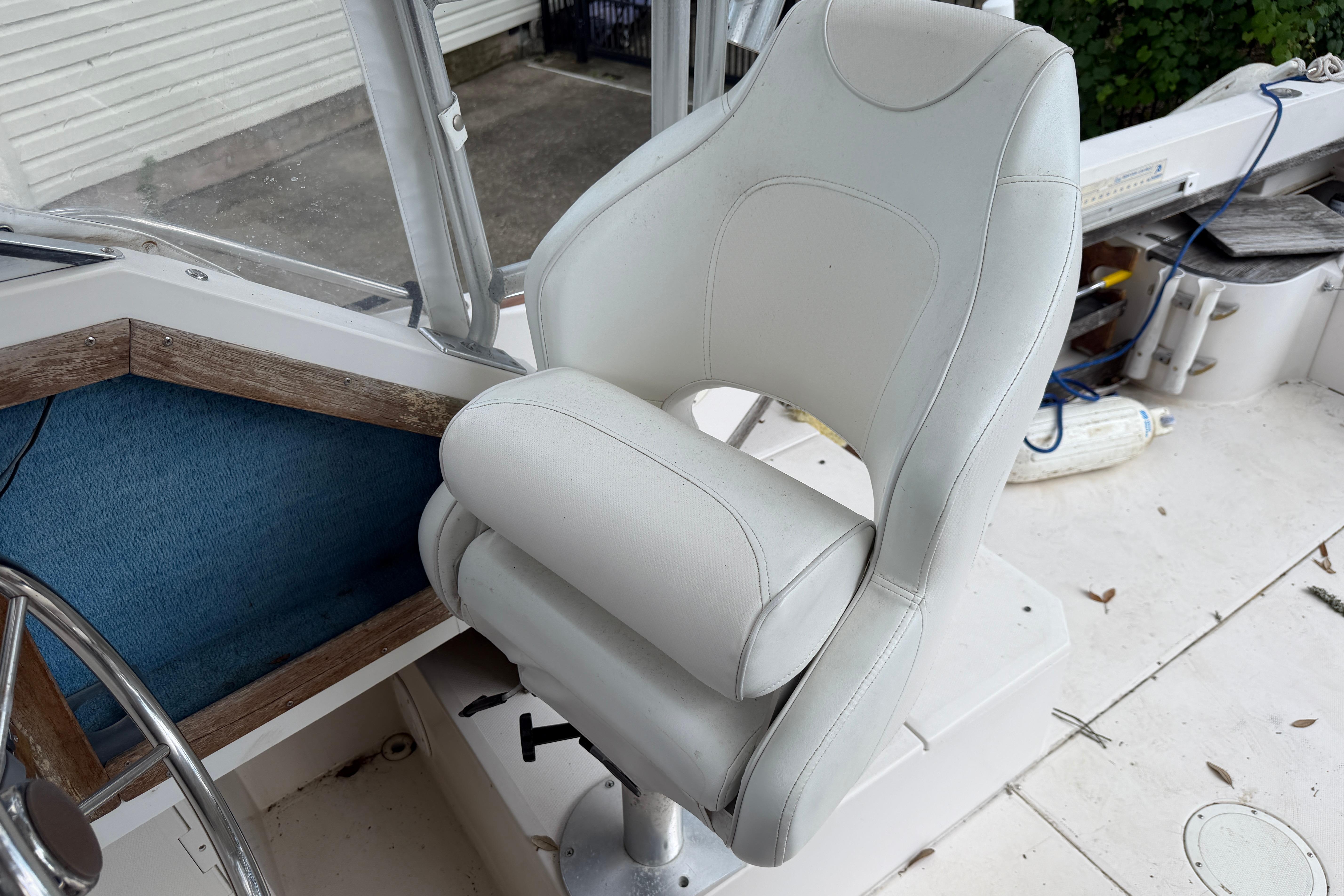 White captain's chair on 1987 Grady-White Seafarer 226 boat deck.