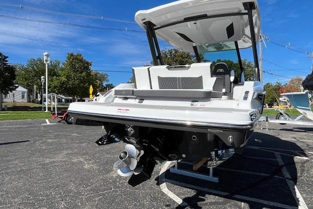 2026 Monterey Elite 27 SD boat, rear view, parked outdoors on a sunny day.