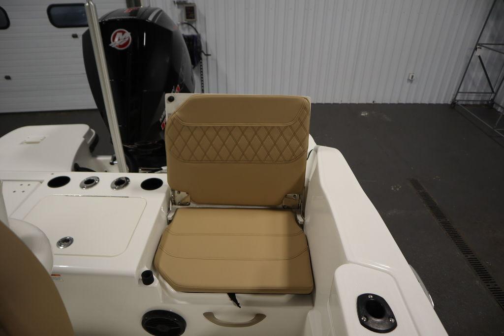 2026 Bayliner Trophy T20CC boat interior with tan seating and motor detail.