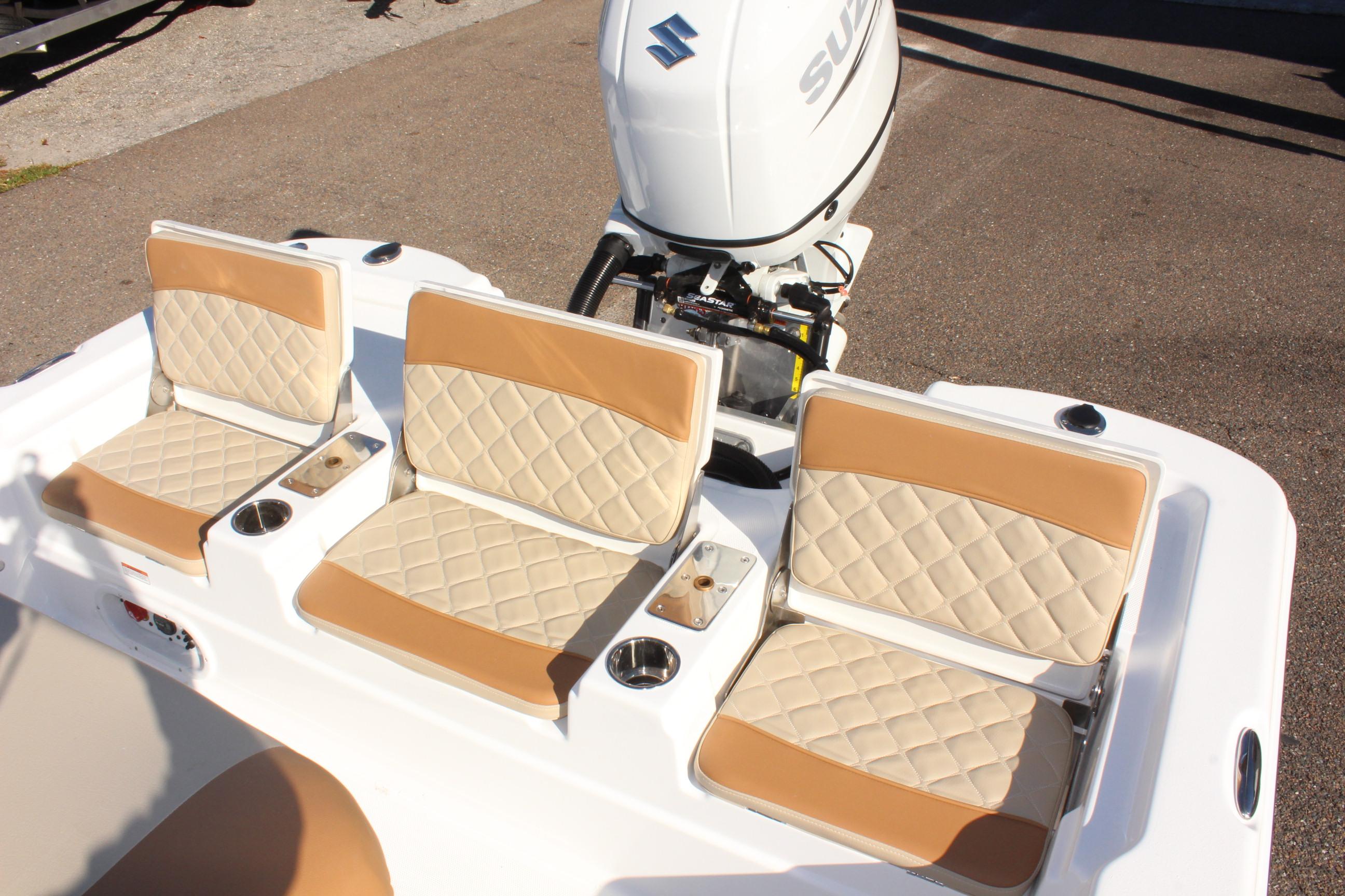 2025 NauticStar 214 Shallow Bay boat seats with Suzuki outboard motor.