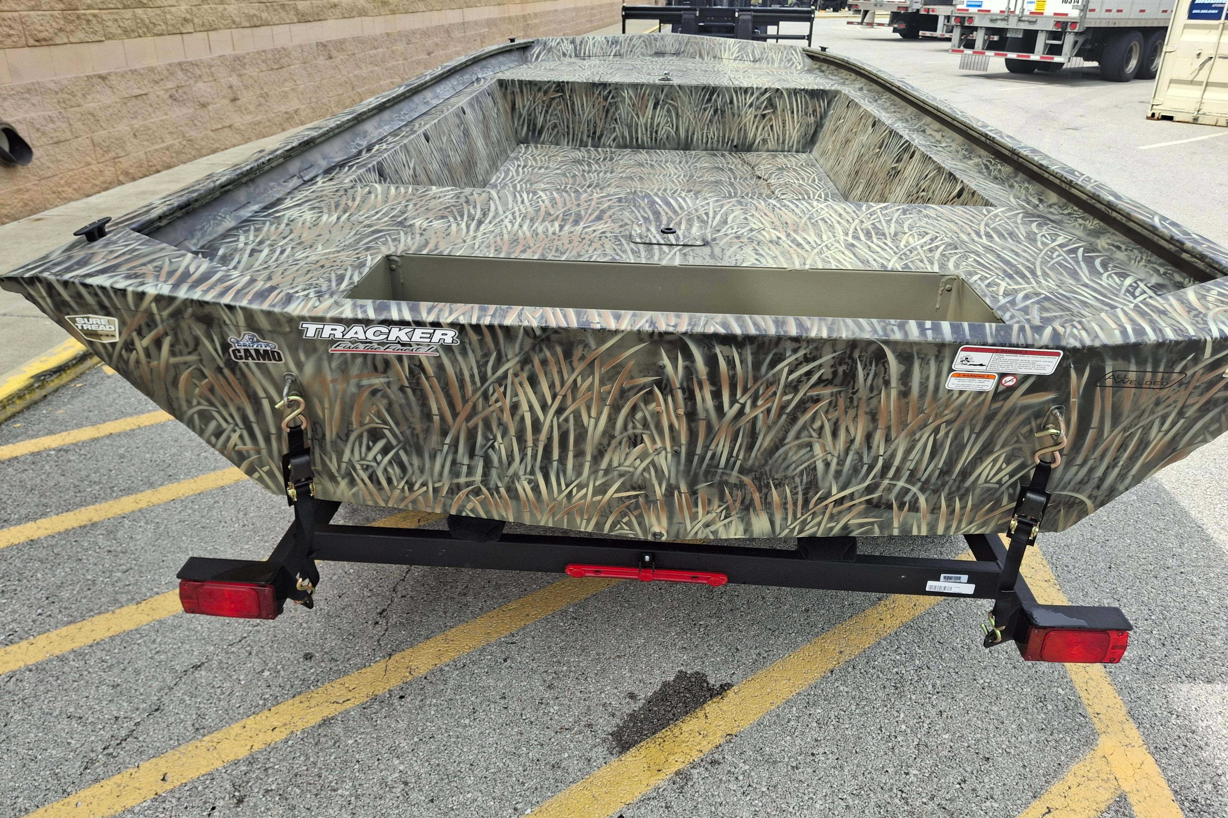 2026 Tracker Grizzly 1860 Utility boat with camo design on a trailer.